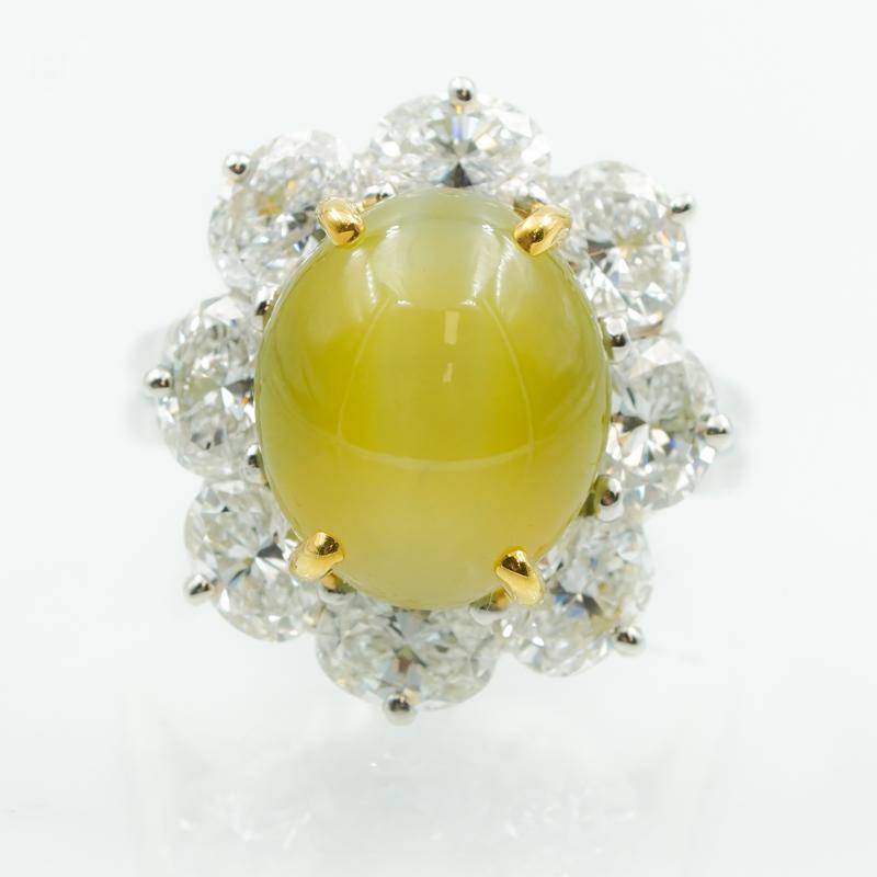 This one-of-a-kind brilliant platinum Cat's-Eye Chrysoberyl ring plays with the light and is sure to stand out while showing off in the sunlight or candlelight! The centerpiece of the ring is a stunning Cat's Eye totaling 10.26 Carats which has been