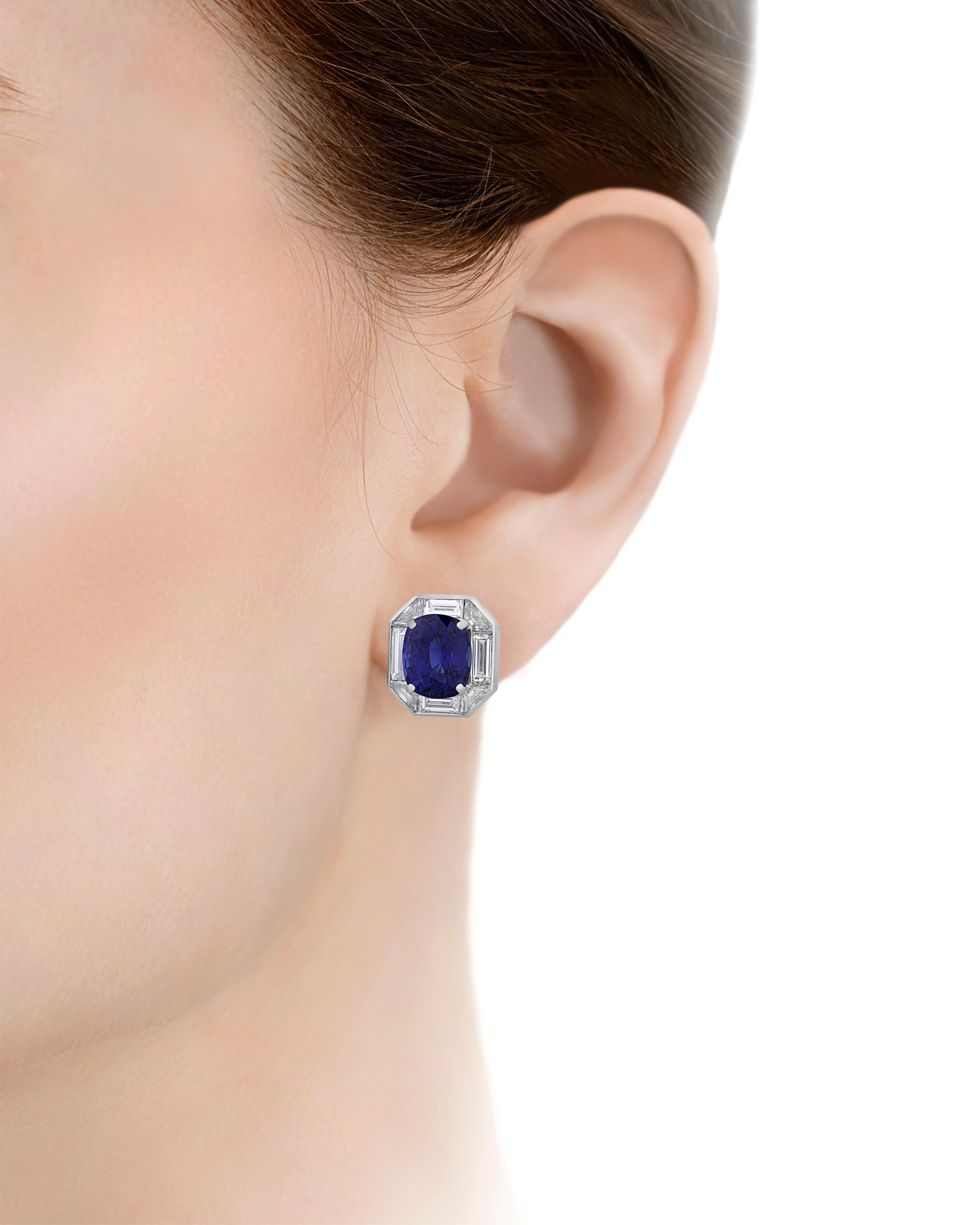 Two impressive cushion cut Ceylon sapphires totaling 10.60 carats are set in these glamorous earrings by famed jewelry designer Oscar Heyman. Displaying a vivid 