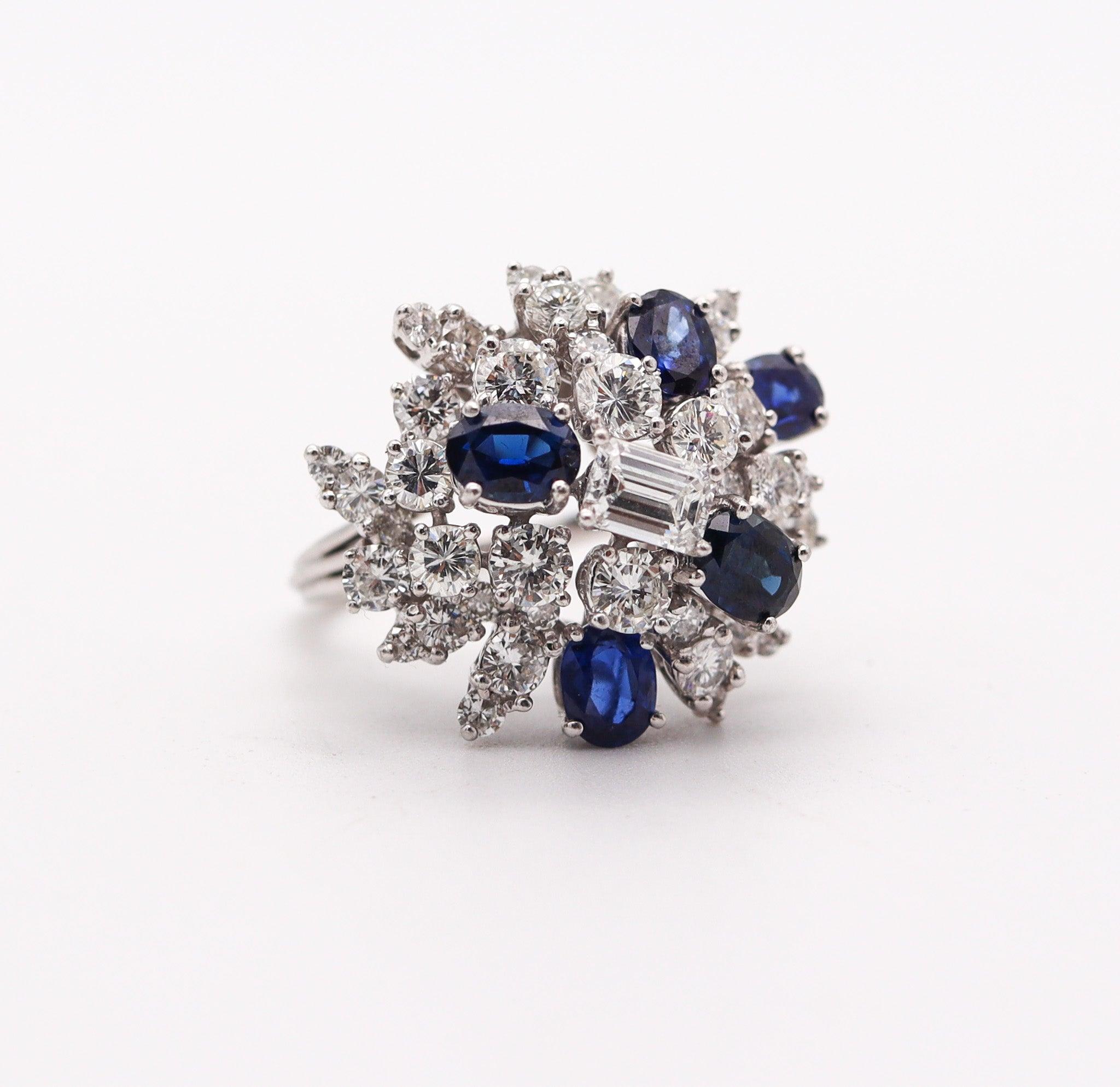 Cocktail ring designed by the Oscar Heyman Brothers.

This is a fabulous cluster cocktail ring, created in New York city by the iconic jewelry makers of Oscar Heyman Company. The gorgeous colorful ring has been crafted in solid platinum with high