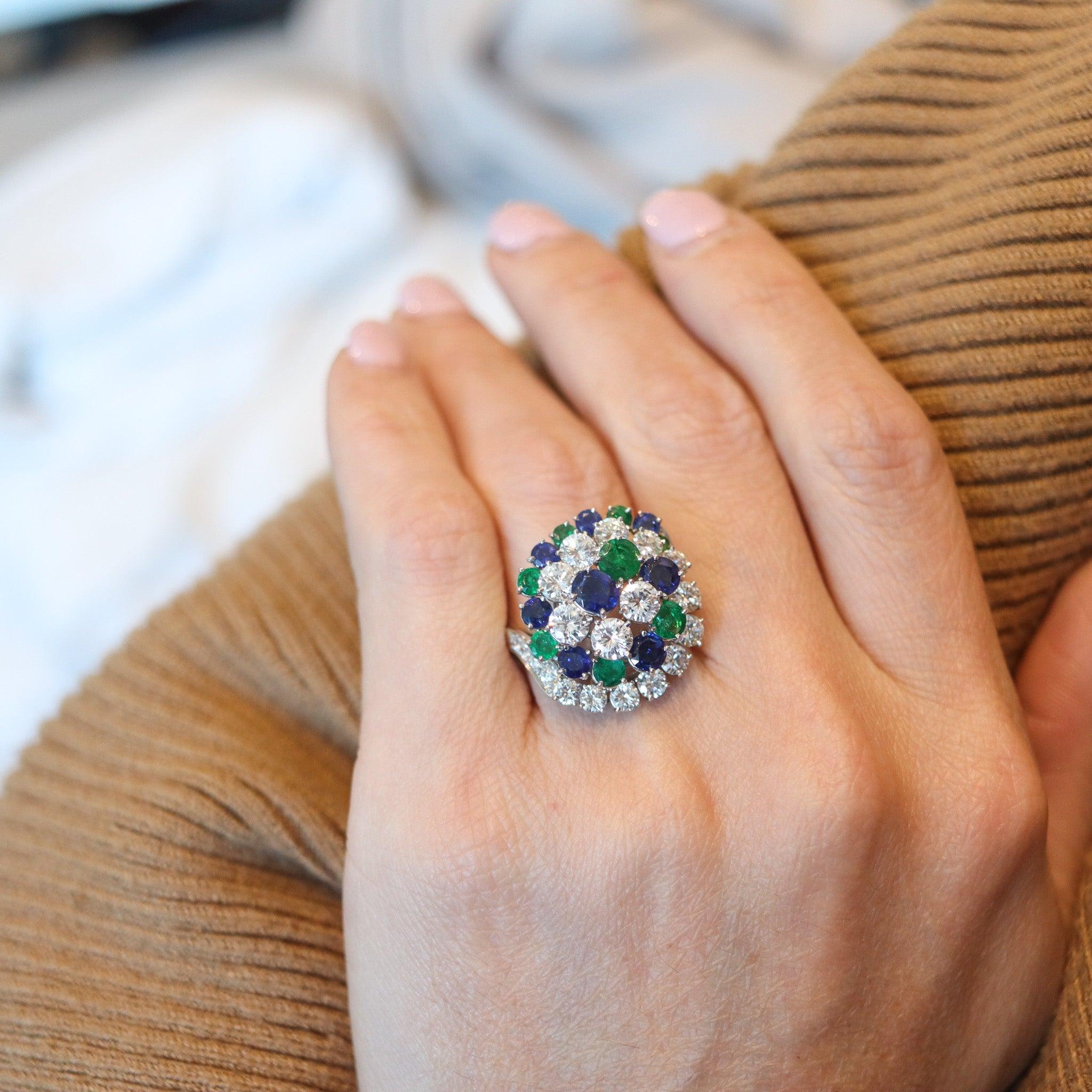 A cluster cocktail ring designed by the Oscar Heyman Brothers.

This is a fantastic cluster cocktail ring created in New York city by the iconic jewelry makers of Oscar Heyman Company, back in the 1950's. The gorgeous colorful ring has been crafted