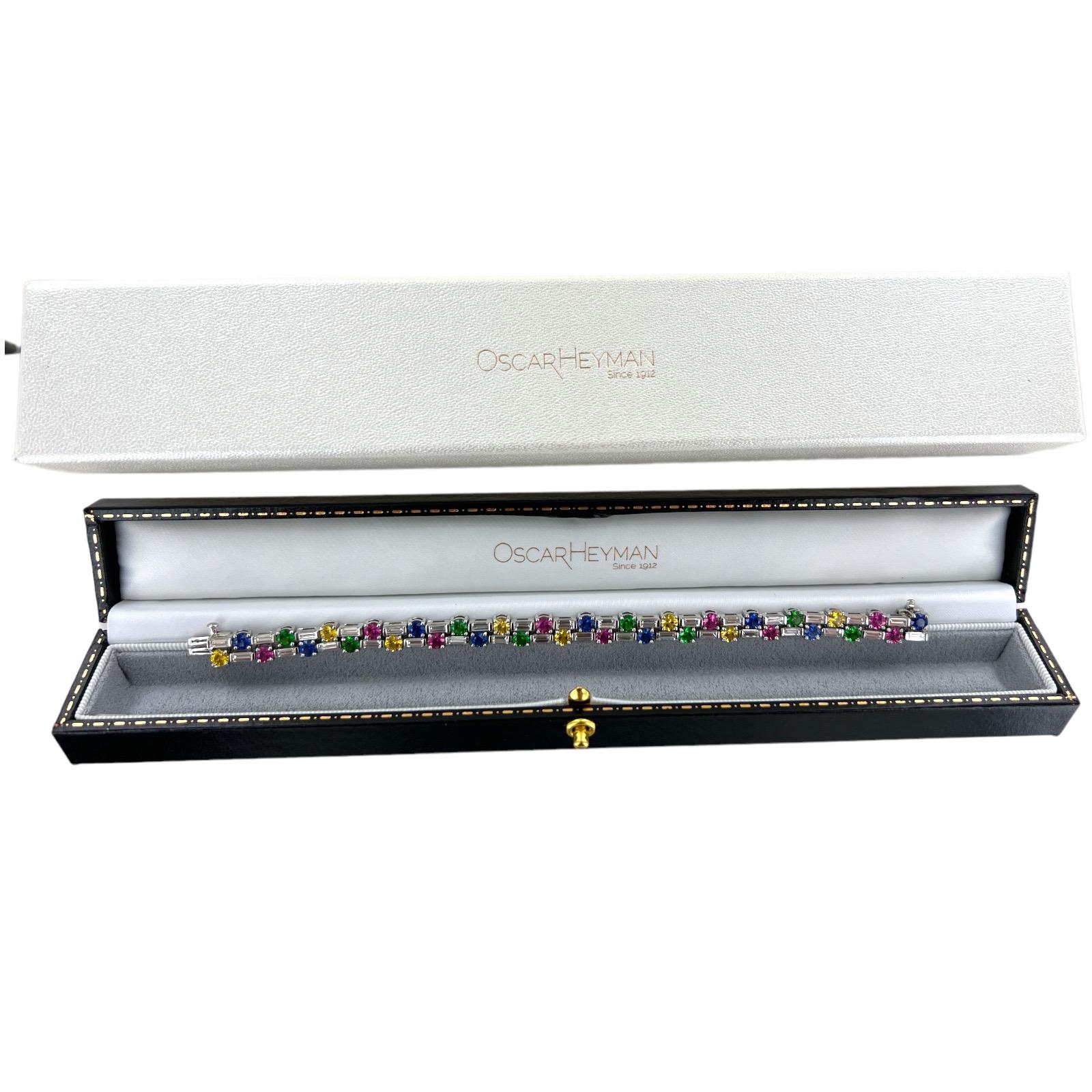 Oscar Heyman's diamond and colorful sapphire bracelet crafted in platinum. The high-end American jeweler is known for his use of color and the bracelet features 34 round colorful sapphires weighing 9.36 CTW and 34 baguette diamonds weighing 4.45
