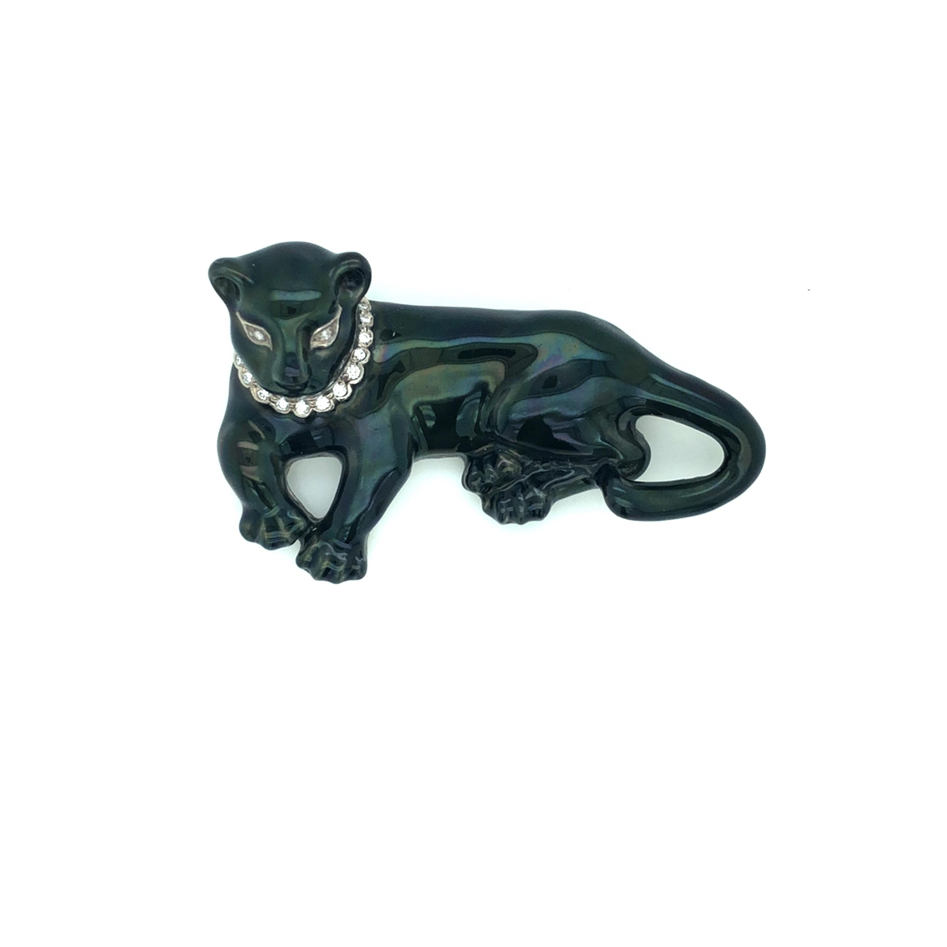 Oscar Heyman 18k white gold black enamel panther brooch wears a diamond collar and has diamond eyes, weighing a total of 0.12tcw. It is stamped with the makers mark, 18K, and serial number 200719. 

The brooch measures 55mm in length, 33mm at widest
