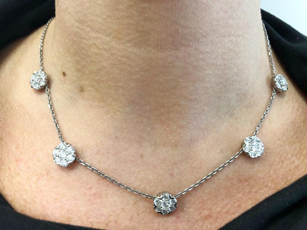 Oscar Heyman Diamond Floret Collar Necklace in Platinum.
A classic collar-length necklace for any wardrobe, this effortless Oscar Heyman piece features five diamond flowers threaded on a delicate platinum chain. Each floret is a cluster of seven