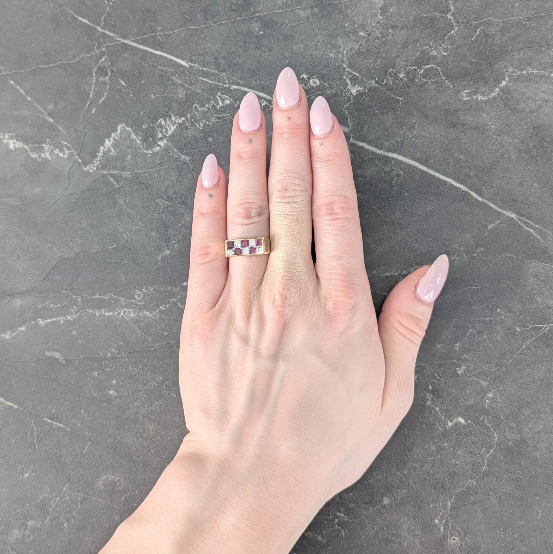 Designed as a band ring centering a curving concave channel
With two rows of square step cut rubies and diamonds
Bead set in platinum as alternating checkerboard pattern
Rubies weigh approximately 0.80 carat total
Transparent medium purplish red in