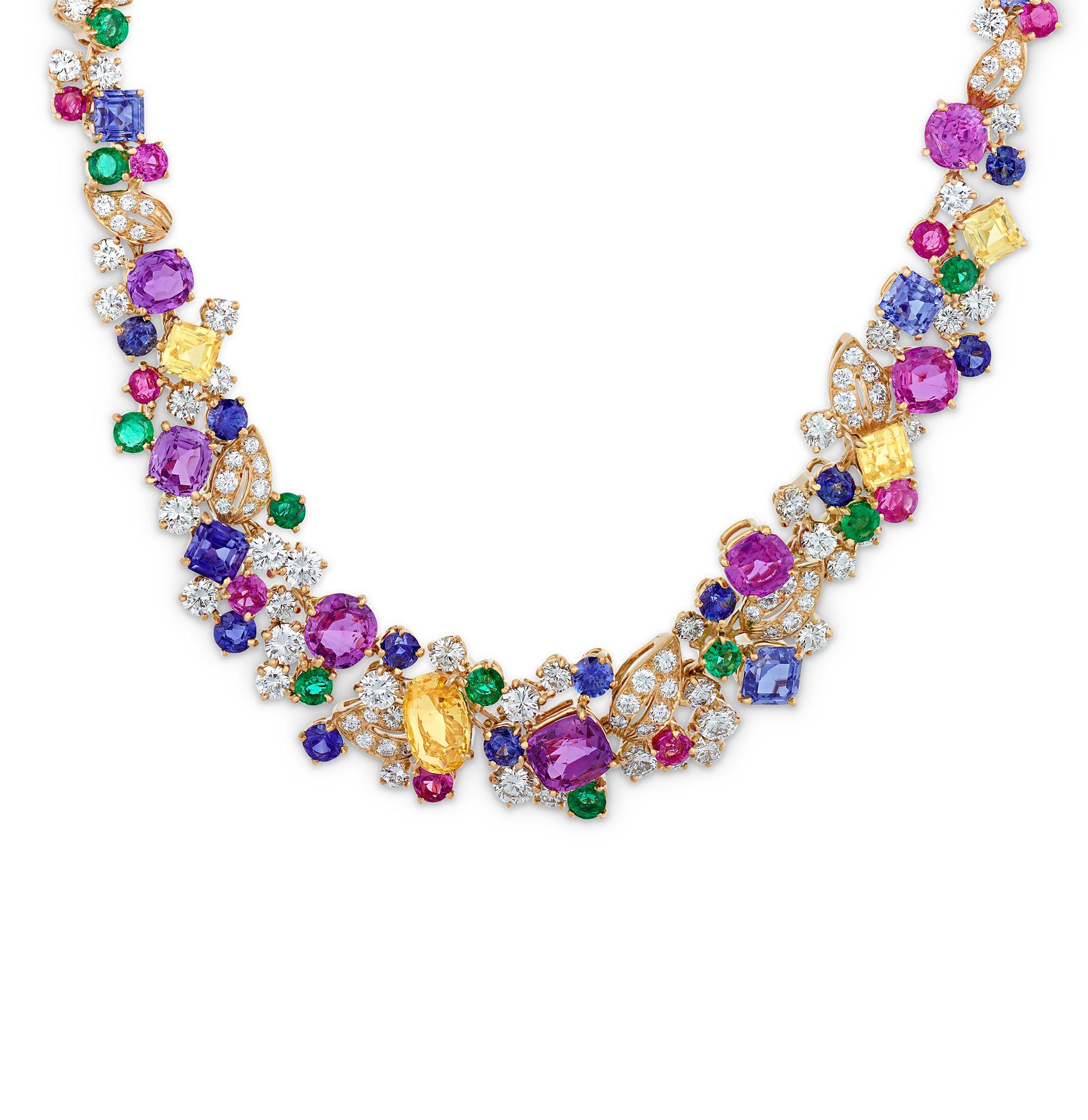 Bursting with vivid color, this extraordinary multi-gemstone necklace is the work of the legendary jewelry designer Oscar Heyman. The spectacular design showcases 39.48 carats of fancy colored sapphires, 12.43 carats of white diamonds, 6.30 carats