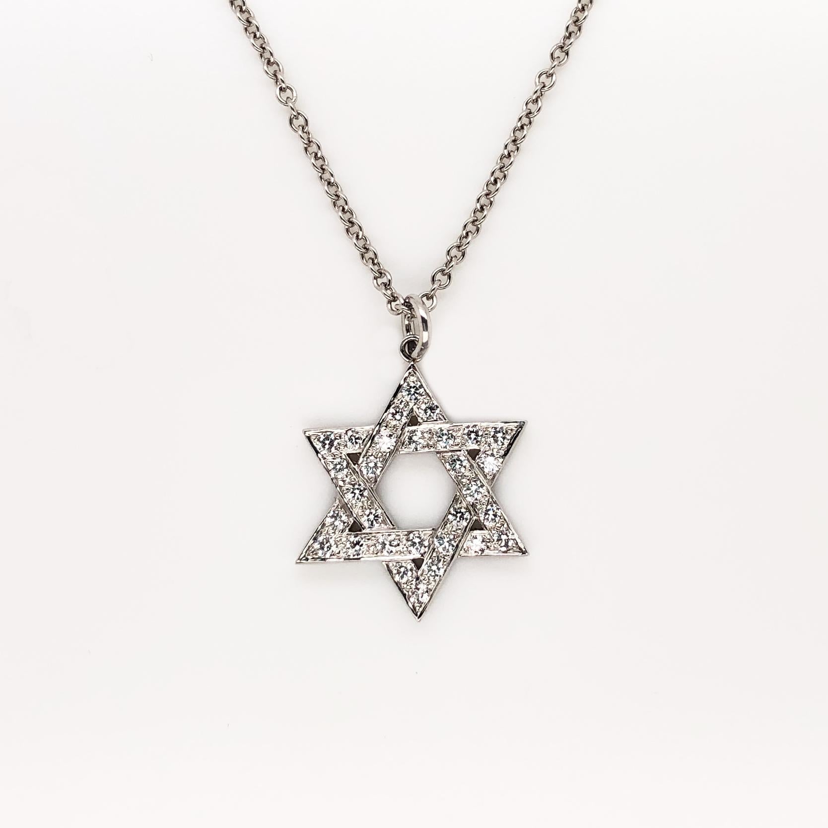 Oscar Heyman platinum Star of David necklace contains 30 round diamonds (0.48cts, F-G/ VS) on an 18'' chain. It is stamped with the makers mark, IRID PLAT, and serial number 903044. The star itself measures 3/4'' in diameter.

Oscar Heyman was