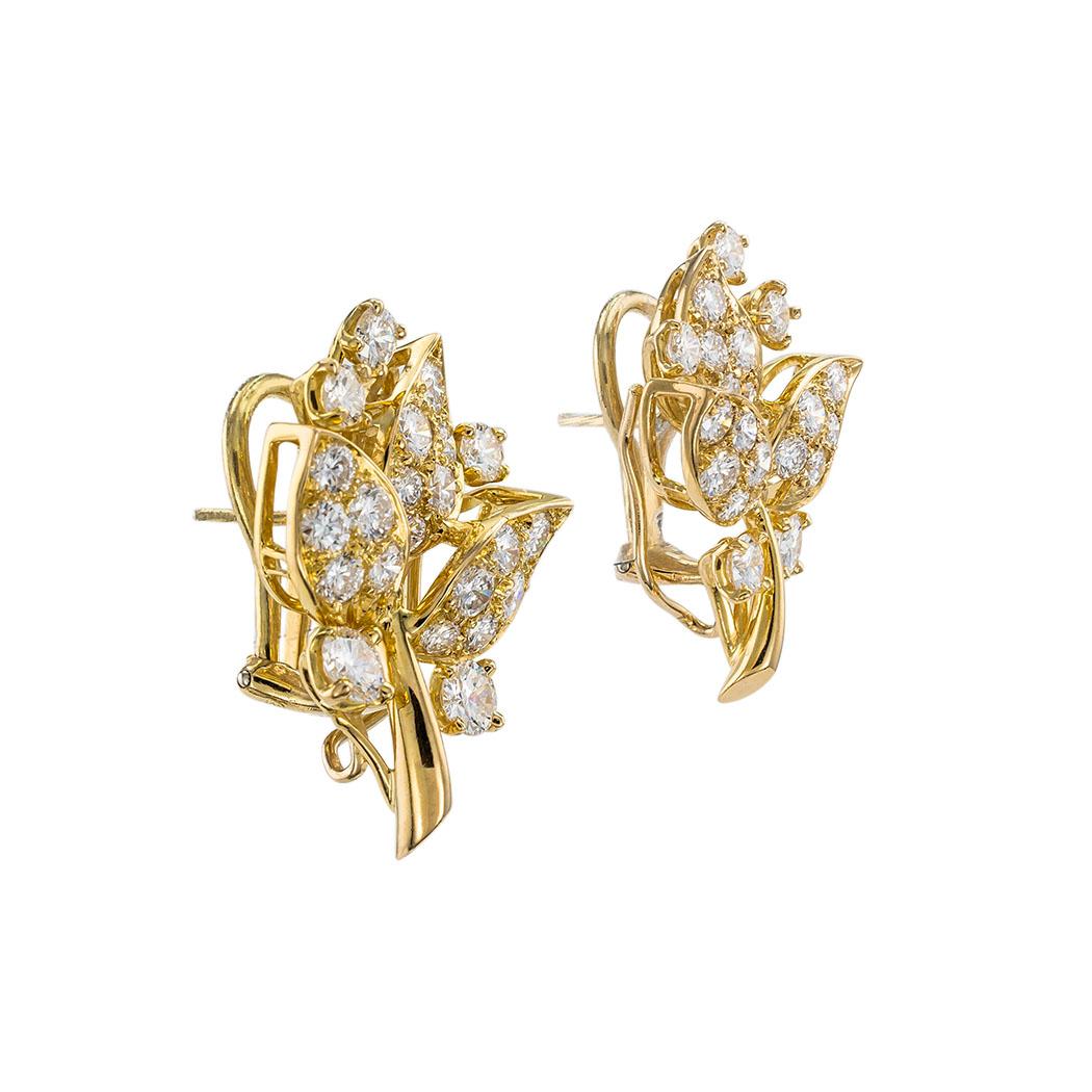 Oscar Heyman diamond and yellow gold cocktail clip-on earrings circa 1980. 

Contact us right away if you have additional questions.  We are here to connect you with beautiful and affordable antique and estate jewelry.

SPECIFICATIONS:

DIAMONDS: 