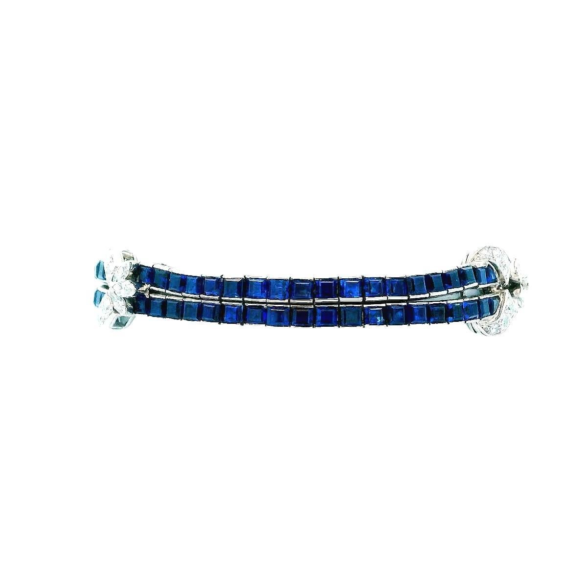 A stunning blue sapphire and diamond bracelet.

It features 20.15 carats of square-cut blue sapphires, exuding a deep, captivating blue hue. Complementing these are 2.65 carats of mixed-cut diamonds, showcasing a brilliant white color with VVS2