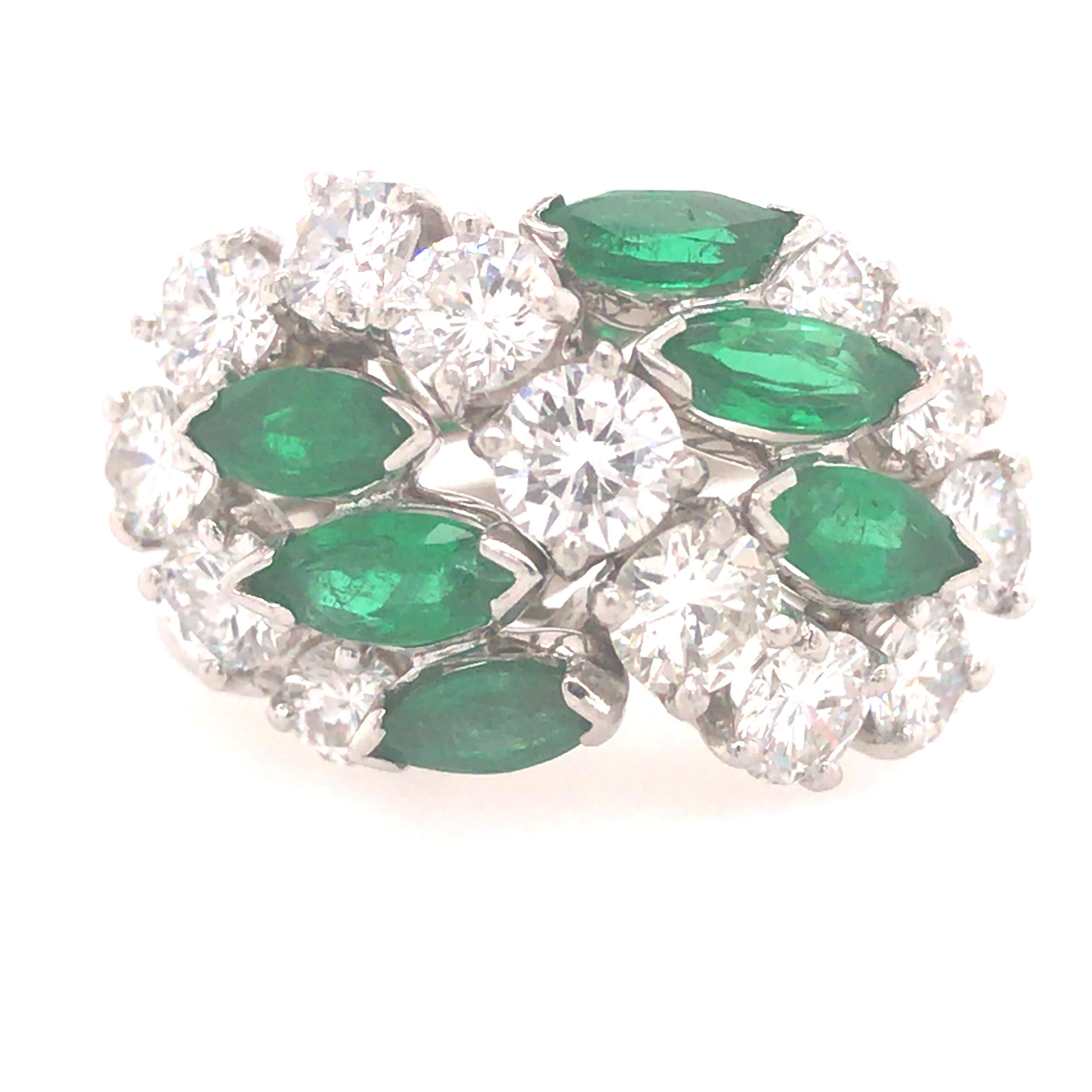 Oscar Heyman Emerald and Diamond Ring in Platinum.  (6)  Marquise Shape Green Emeralds weighing 1.80 carat total weight and (13) Round Brilliant Cut Diamonds weighing 2.02 carat total weight, F-G in color and VS in clarity are expertly set.  Ring