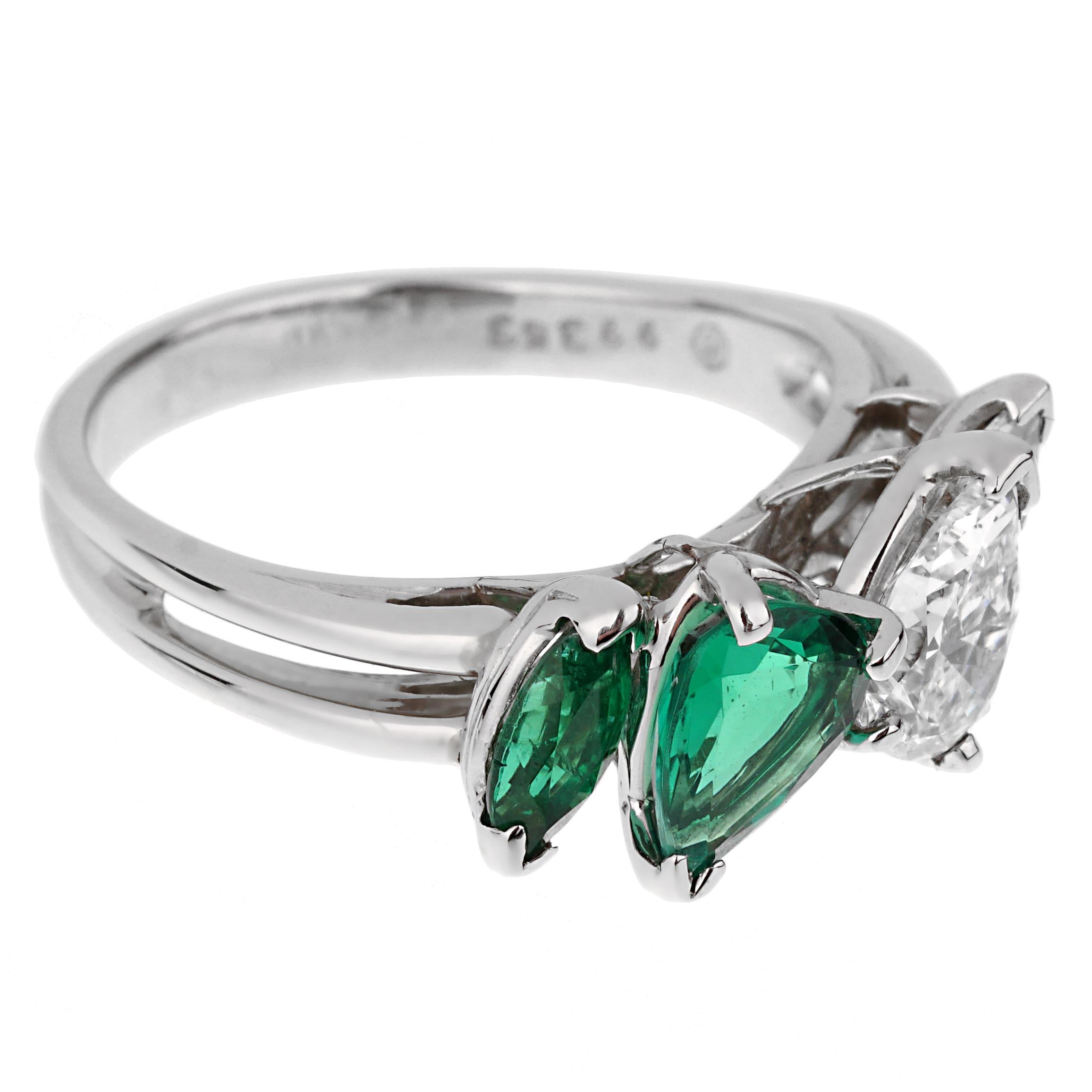 An incredible Oscar Heyman cocktail ring showcasing a 2 rich natural emeralds, the pear shaped GIA graded emerald measures .66ct and a .10ct marquise cut followed by a GIA certified D color VS1 pear shaped diamond, and a ,10ct marquise cut diamonds.