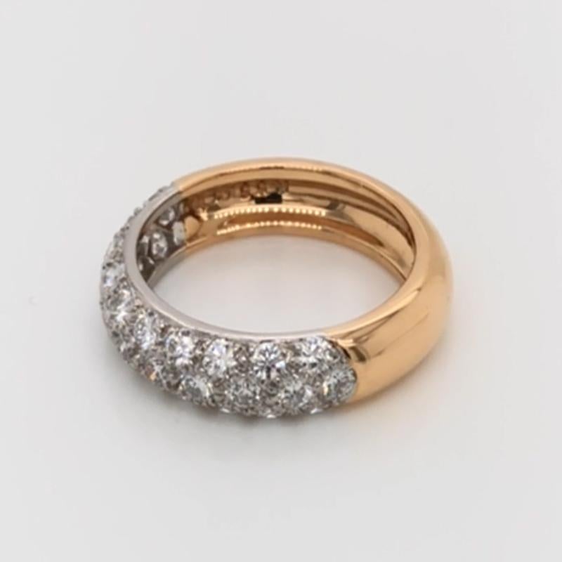 Oscar Heyman 18kt yellow gold & platinum diamond band ring contains 31 Round Diamonds (F-G/ VS+ quality) weighing 1.12cts that are bead set. It is 4mm wide and stamped with the makers mark, 18K PLAT, and serial number K5546. 

Size 6. This ring can