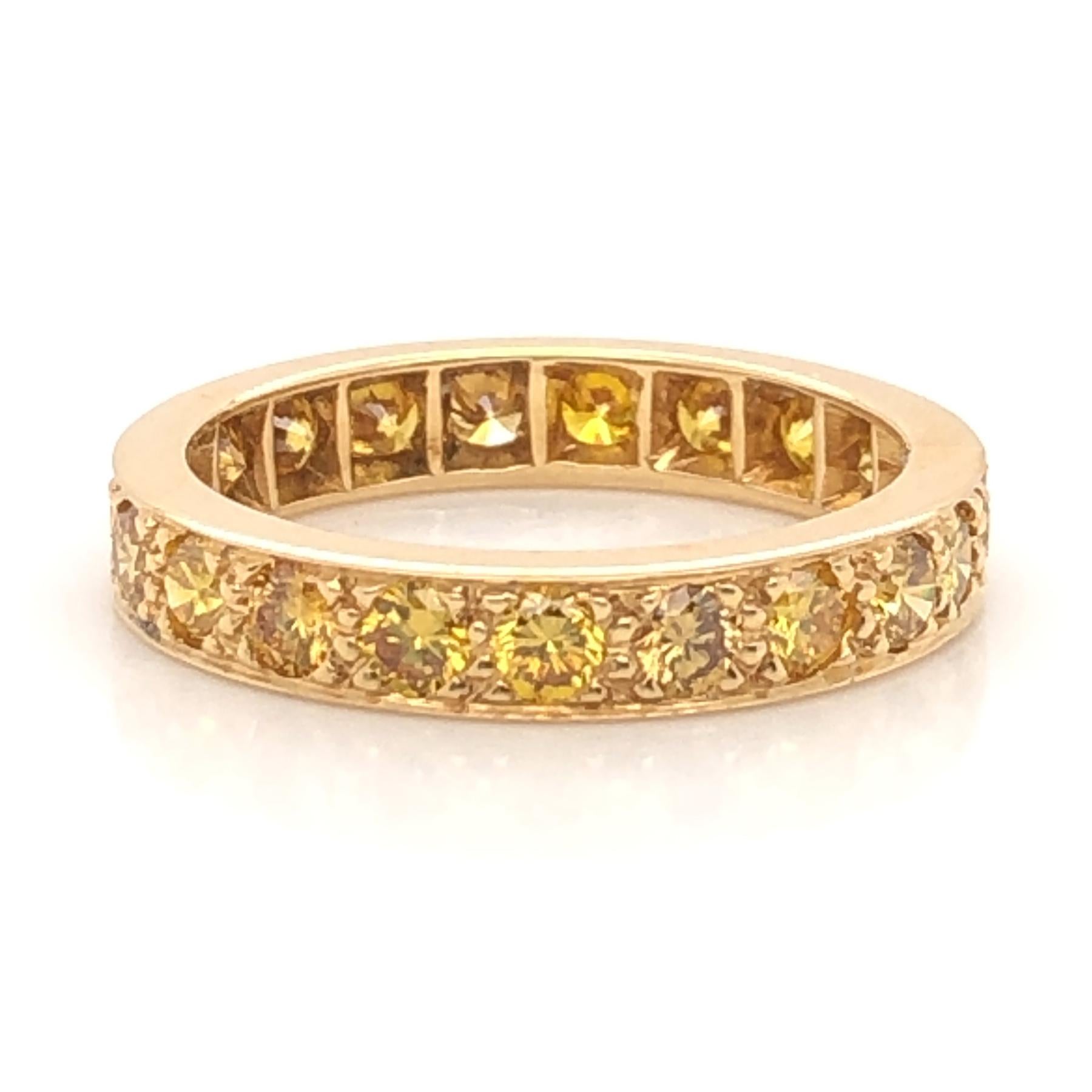 Oscar Heyman 18kt yellow gold wedding band ring contains 21 Fancy Golden Yellow Diamonds weighing 1.65cts that are bead set. It is 3.5mm wide and stamped with the makers mark, 18K, and serial number W3482. 

Size 6.5.

Additional sizes and widths