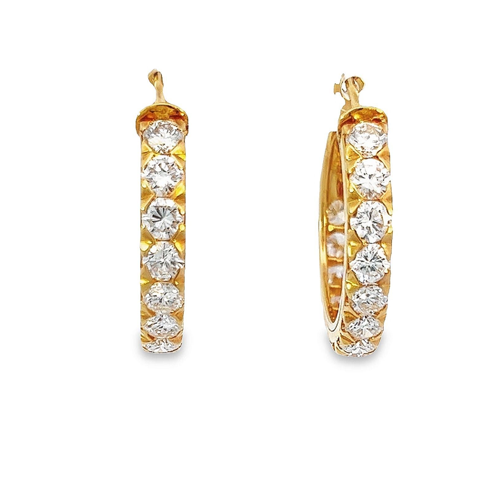Oscar Heyman 18k yellow gold diamond hoop earrings feature 4 carats of round brilliant-cut diamonds, G/H color, and VS clarity. These dazzling gems possess a captivating sparkle and purity that make them an ideal choice for daily wear. Their radiant