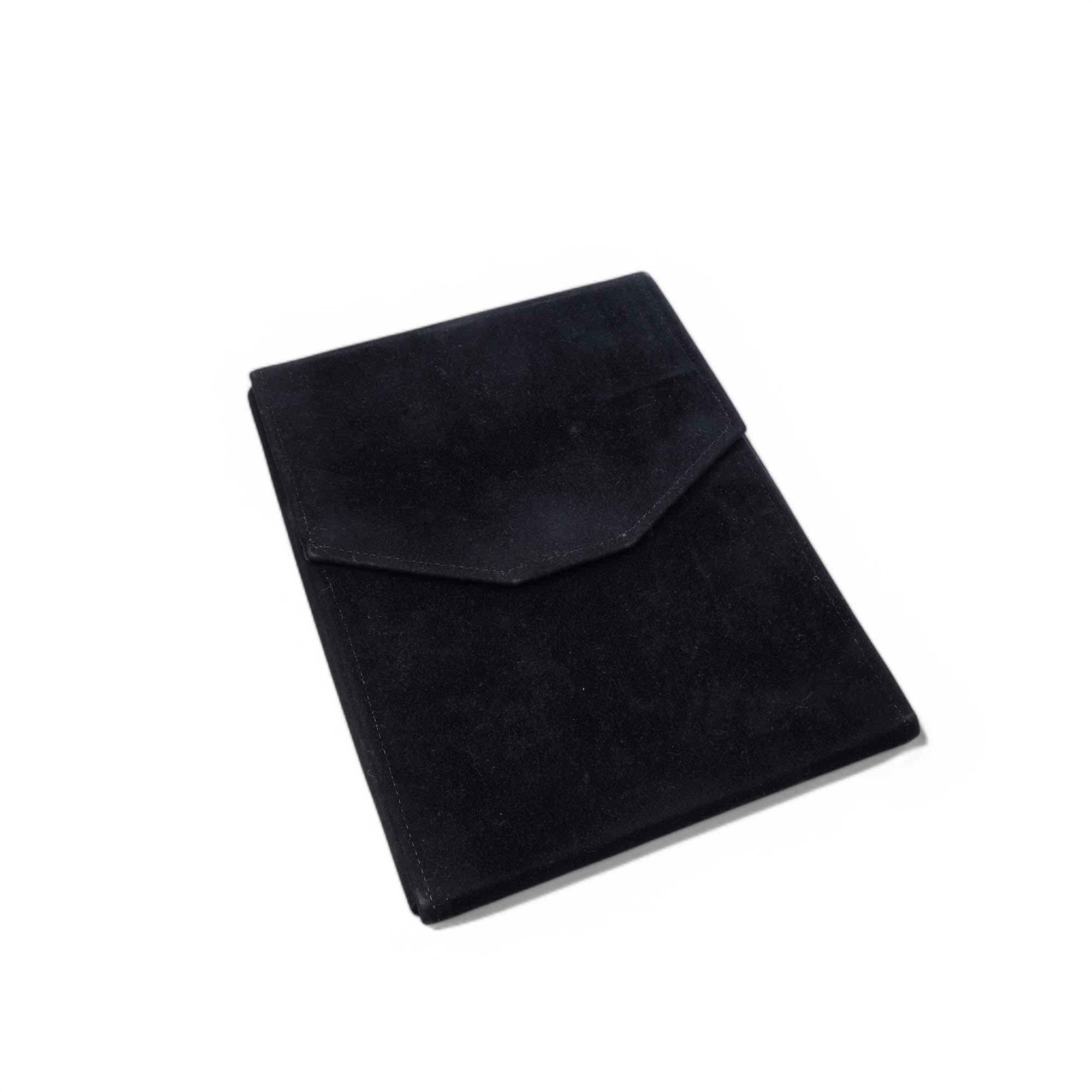 Period: Late 20th century
Material: Black leather exterior with a soft suede-lined interior featuring multiple compartments
Purpose: Travel-friendly case for organizing and storing multiple jewelry items
Dimensions: 20.5 x 16 x 1.7 cm
Condition: