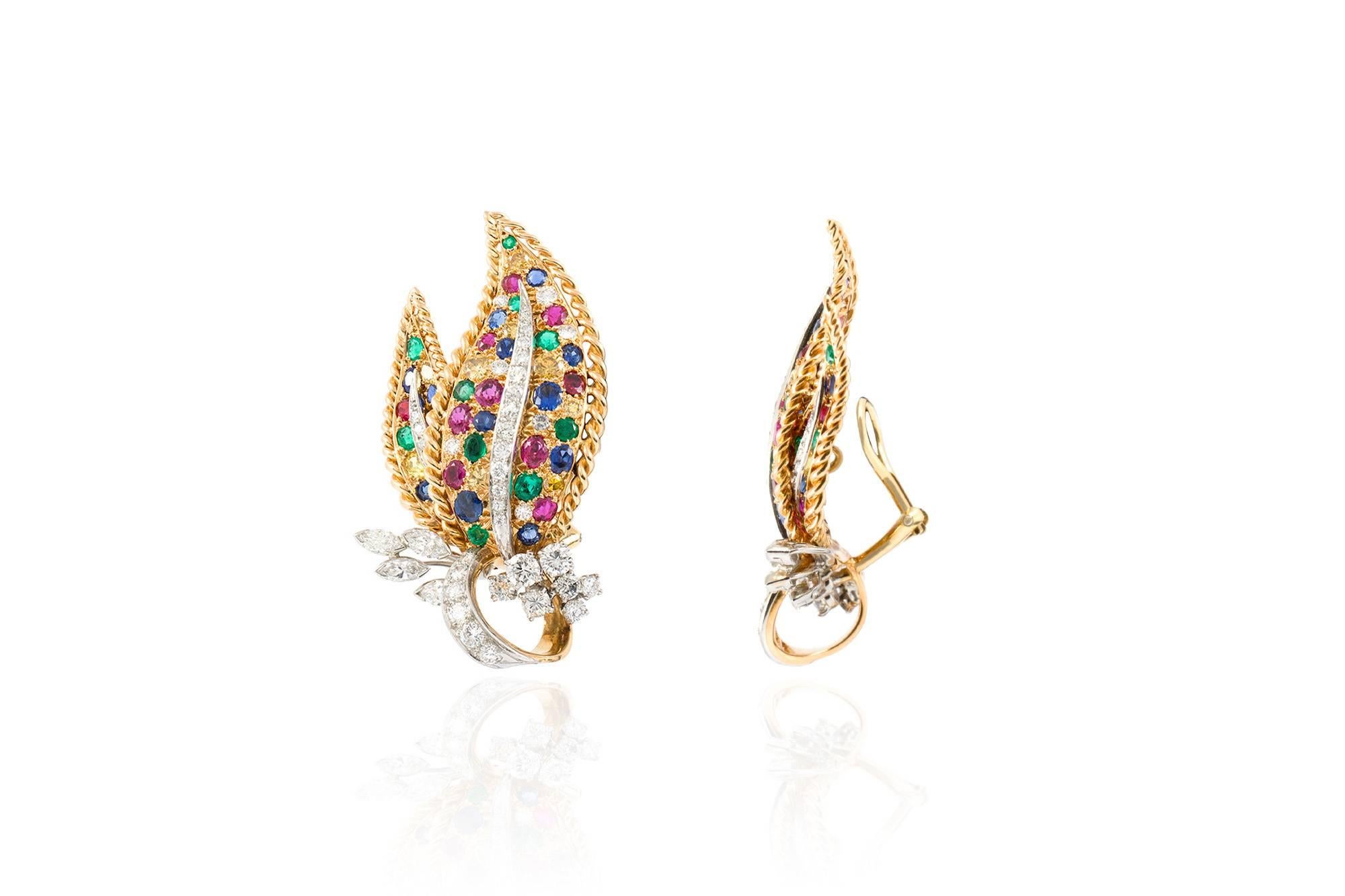 Leaf earrings, finely crafted in 18 k yellow and white gold with multi color stones and diamond. Signed Oscar Heyman.