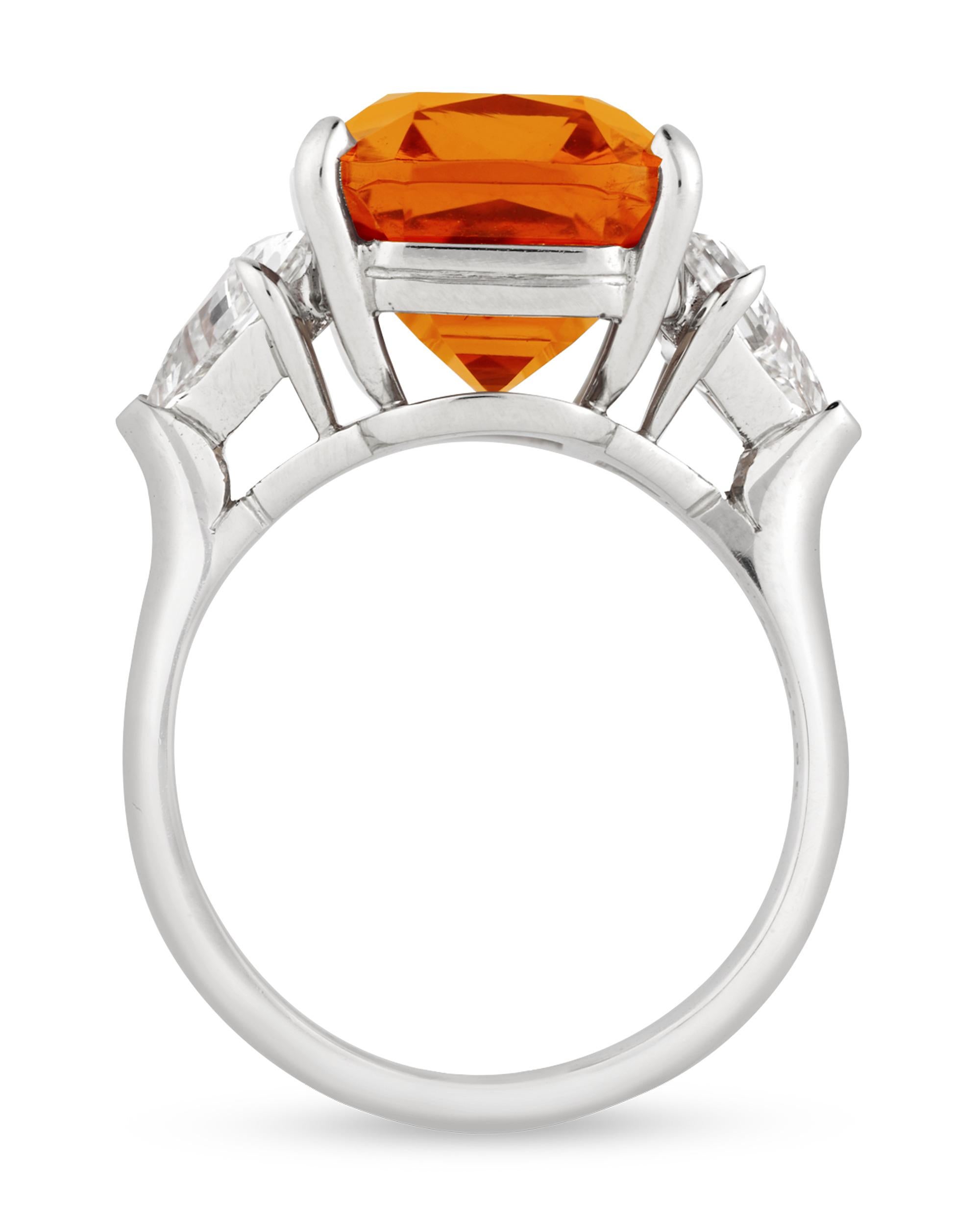 The radiance of the sunset shines from this rare orange Spessartite garnet ring by Oscar Heyman. Featuring a blazing mandarin color, the gemstone is certified by GemResearch Swisslabs as displaying a natural 
