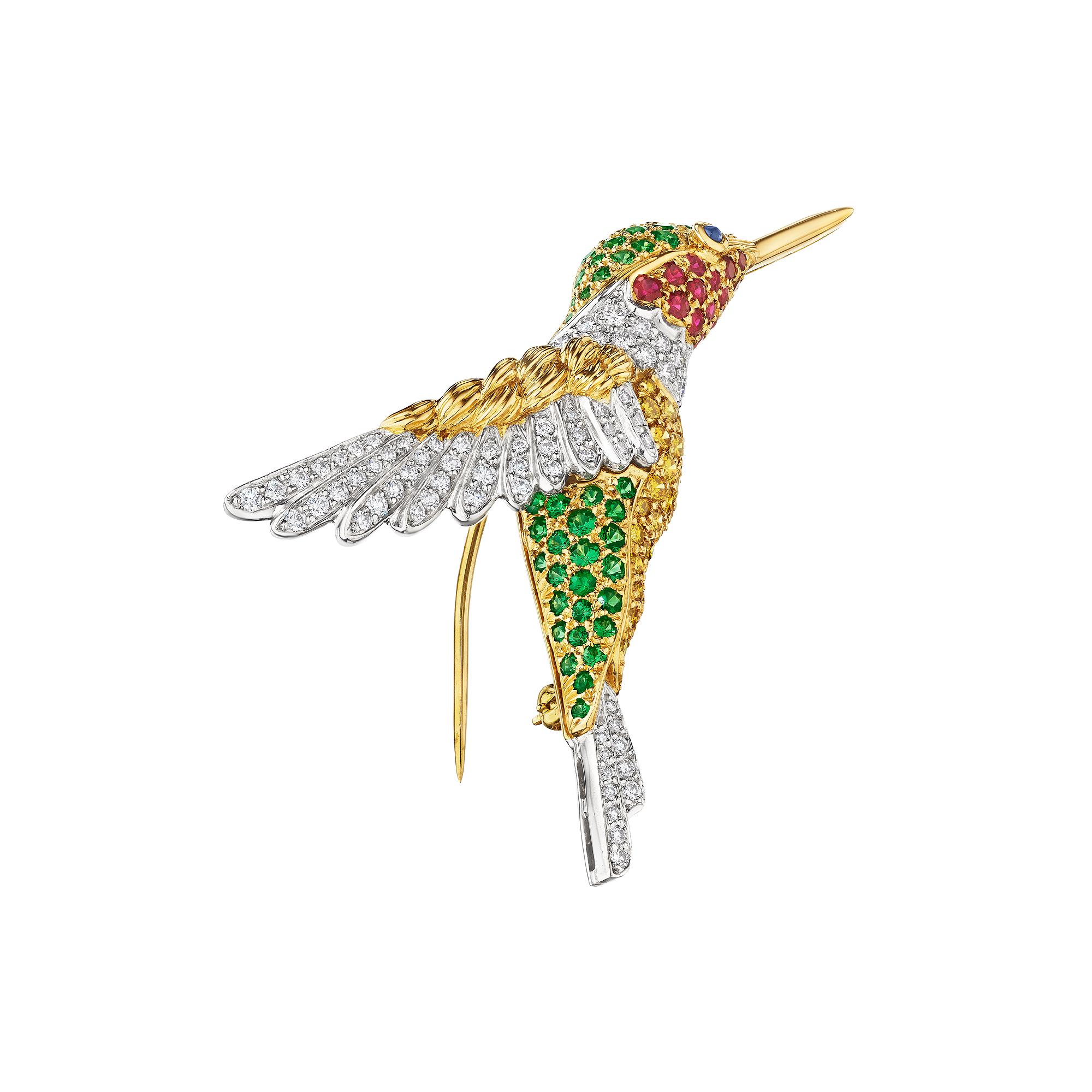 Birds of a feather flock together.  Find the perfect match with this Oscar Heyman modernist yellow and white diamond, tsavorite garnet, ruby, 18 karat yellow gold hummingbird brooch.  Signed OH with serial number 200362.  Circa 2000.    2 5/8