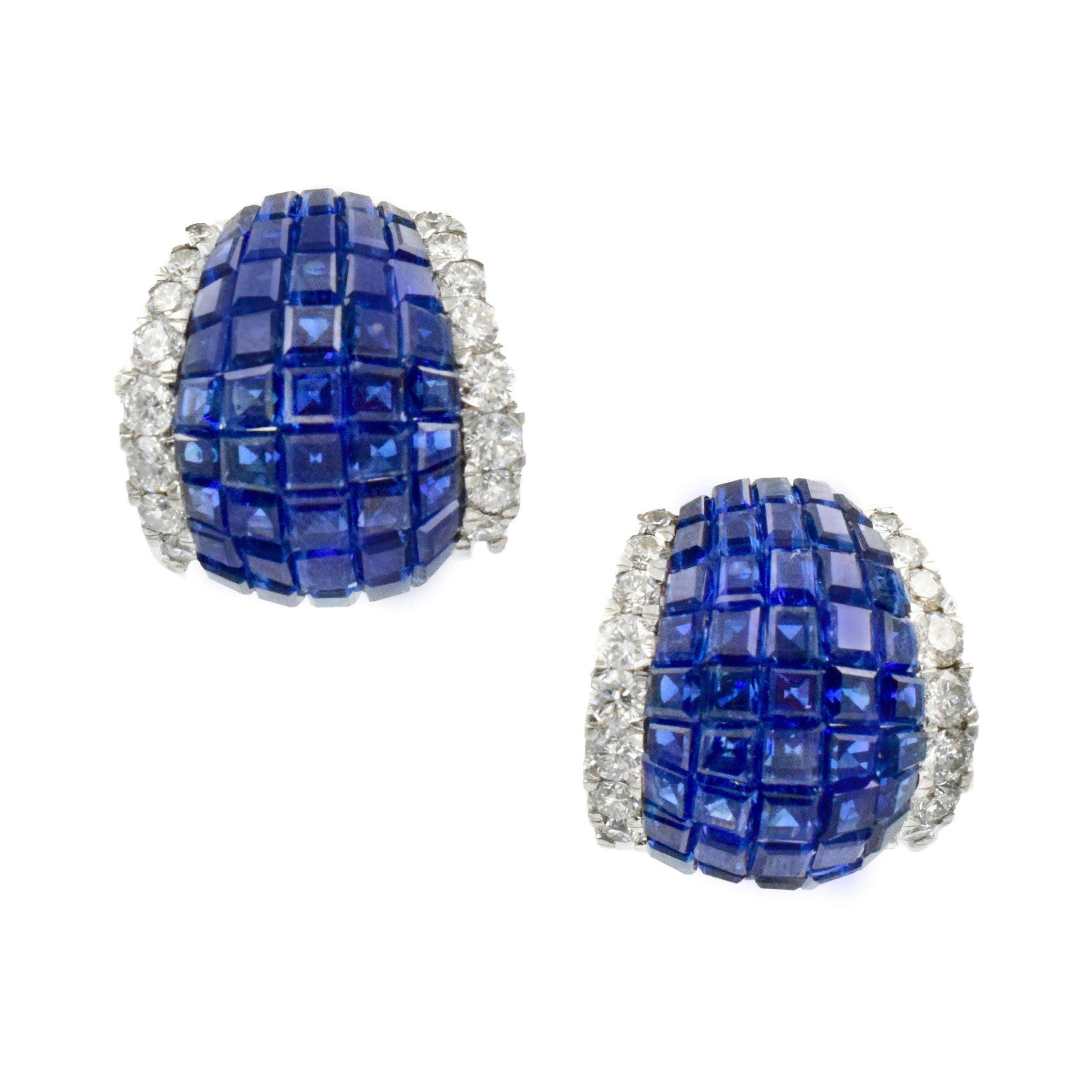 Oscar Heyman Invisibly Set Sapphire and Diamond Earrings. This pair of
earrings has invisible set square sapphire weighing approximately 10
carats and round diamonds weighing a total of 2.5 carats all set in platinum with an omega back. Maker's Mark