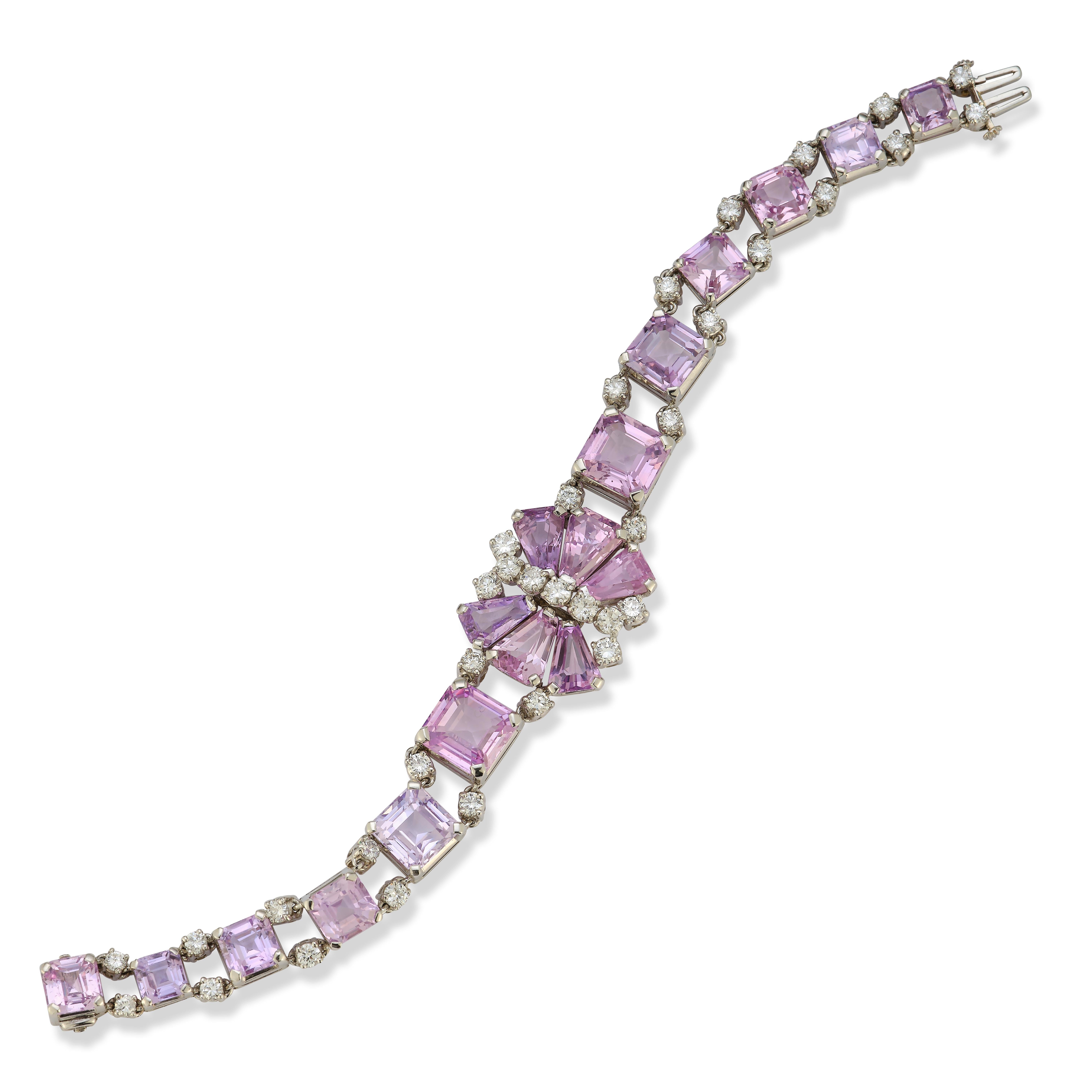 Oscar Heyman Brothers Pink Sapphire & Diamond Bracelet

A Platinum bracelet set with 6 central tapered baguette pink sapphires flanked on both sides by 12 graduating square pink sapphires, accented throughout by 35 round cut diamonds

Signed Oscar