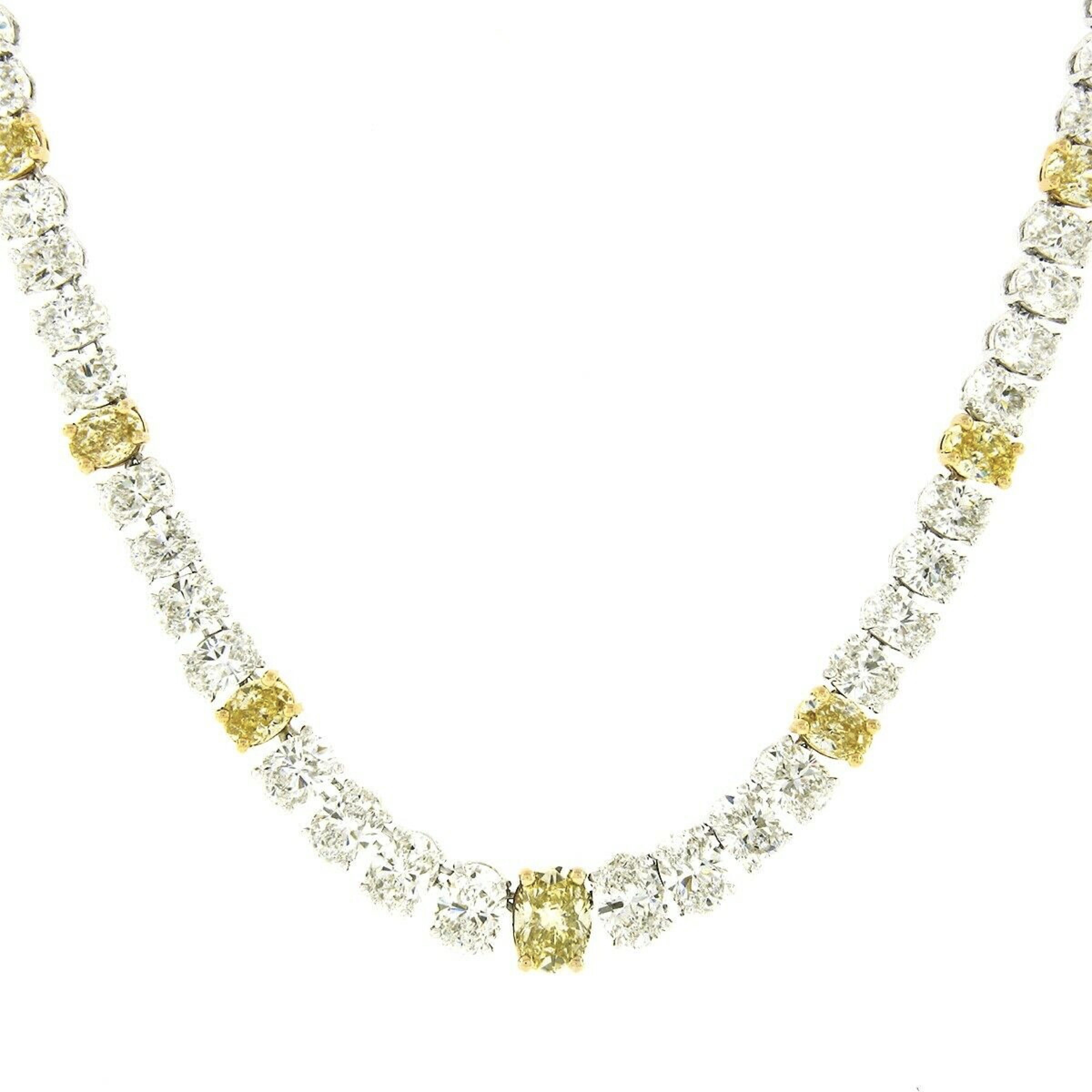 Offering this absolutely stunning diamond tennis necklace that is designed by Oscar Heyman and crafted in solid platinum and 18k yellow gold, featuring 95 fine quality and slightly graduated oval brilliant cut diamonds throughout. The diamonds are