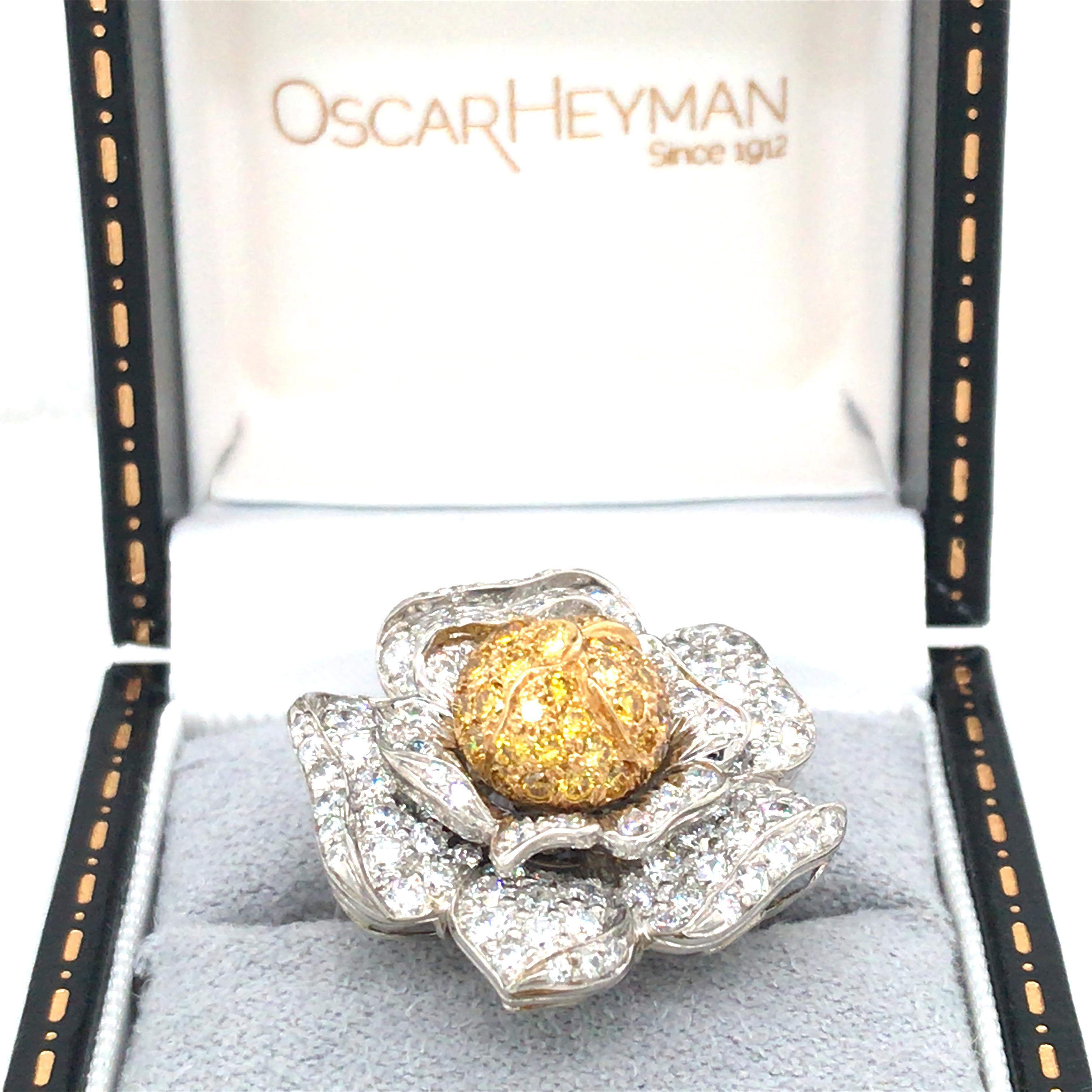 This Oscar Heyman flower ring is crafted in gold and platinum and depicts the scene of a flower in full bloom. A certification by Osacr Heyman states this ring consists of 102 round diamonds 2.48cts and 42 round fancy golden yellow diamonds 0.93ct.