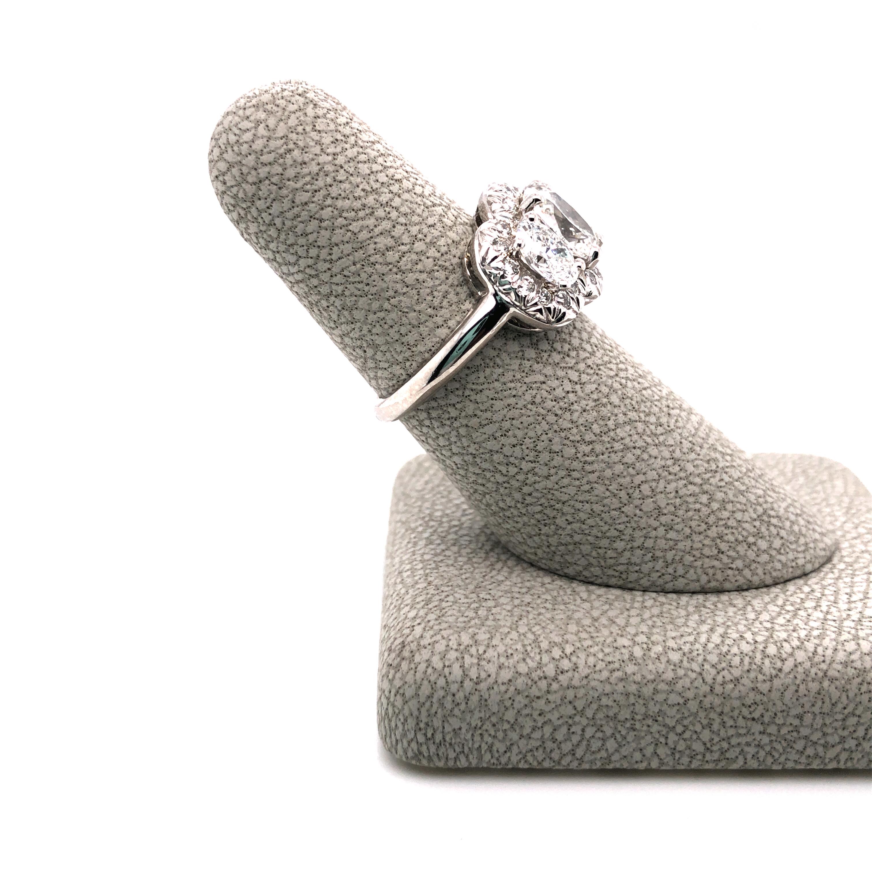Contemporary Oscar Heyman Platinum GIA Certified Oval Diamond with Halo Three-Stone Ring For Sale