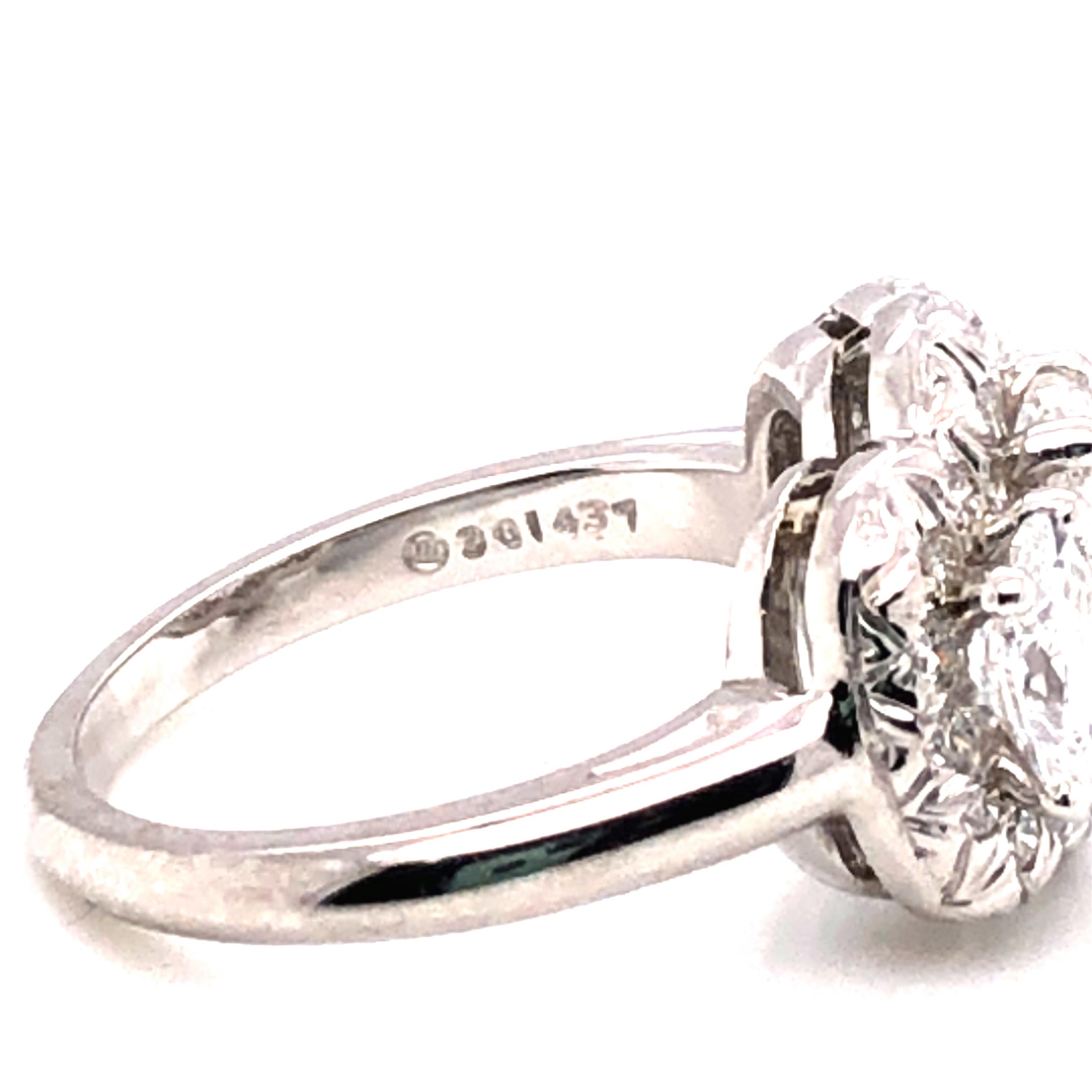 Oscar Heyman Platinum GIA Certified Oval Diamond with Halo Three-Stone Ring In New Condition For Sale In New York City, NY