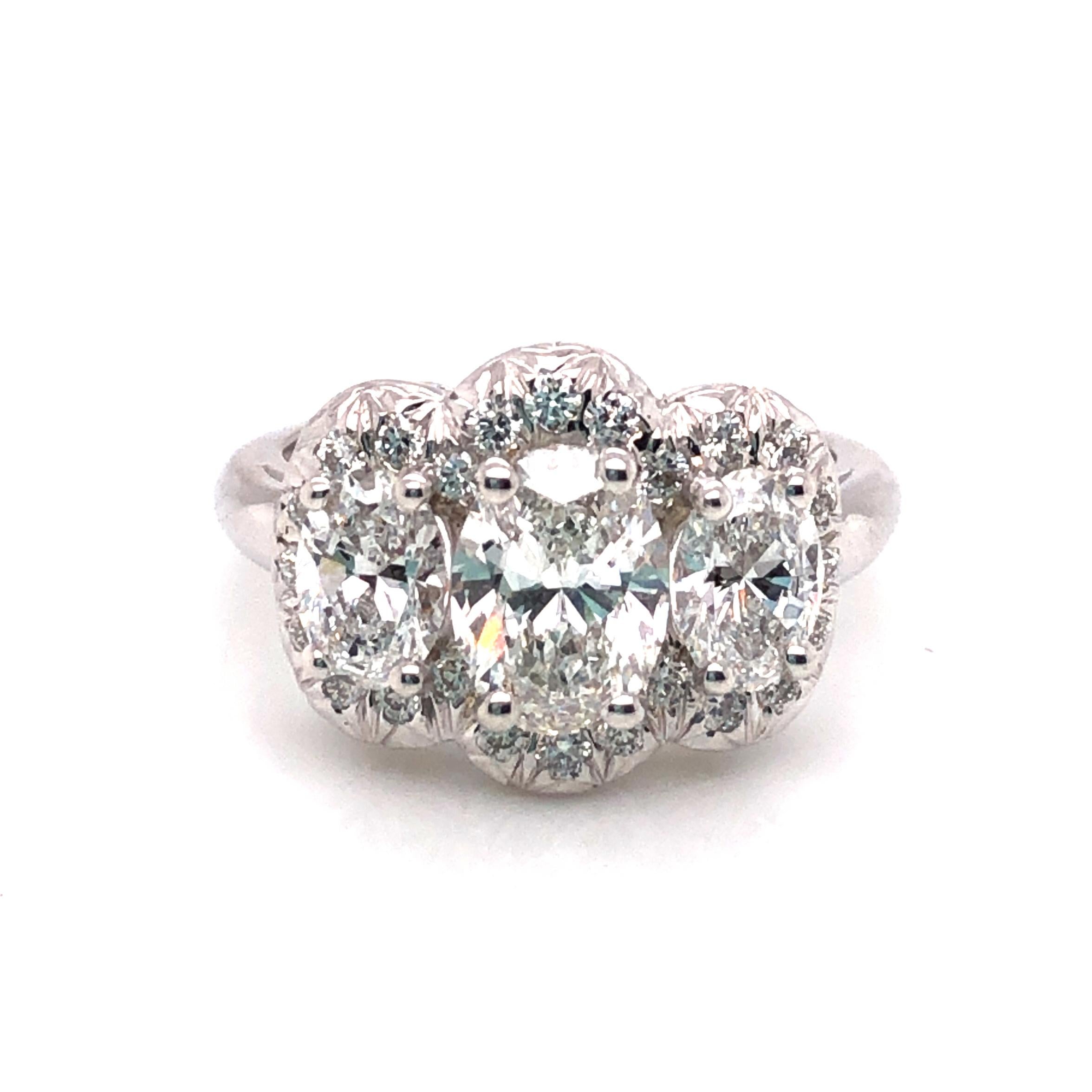 Women's Oscar Heyman Platinum GIA Certified Oval Diamond with Halo Three-Stone Ring For Sale