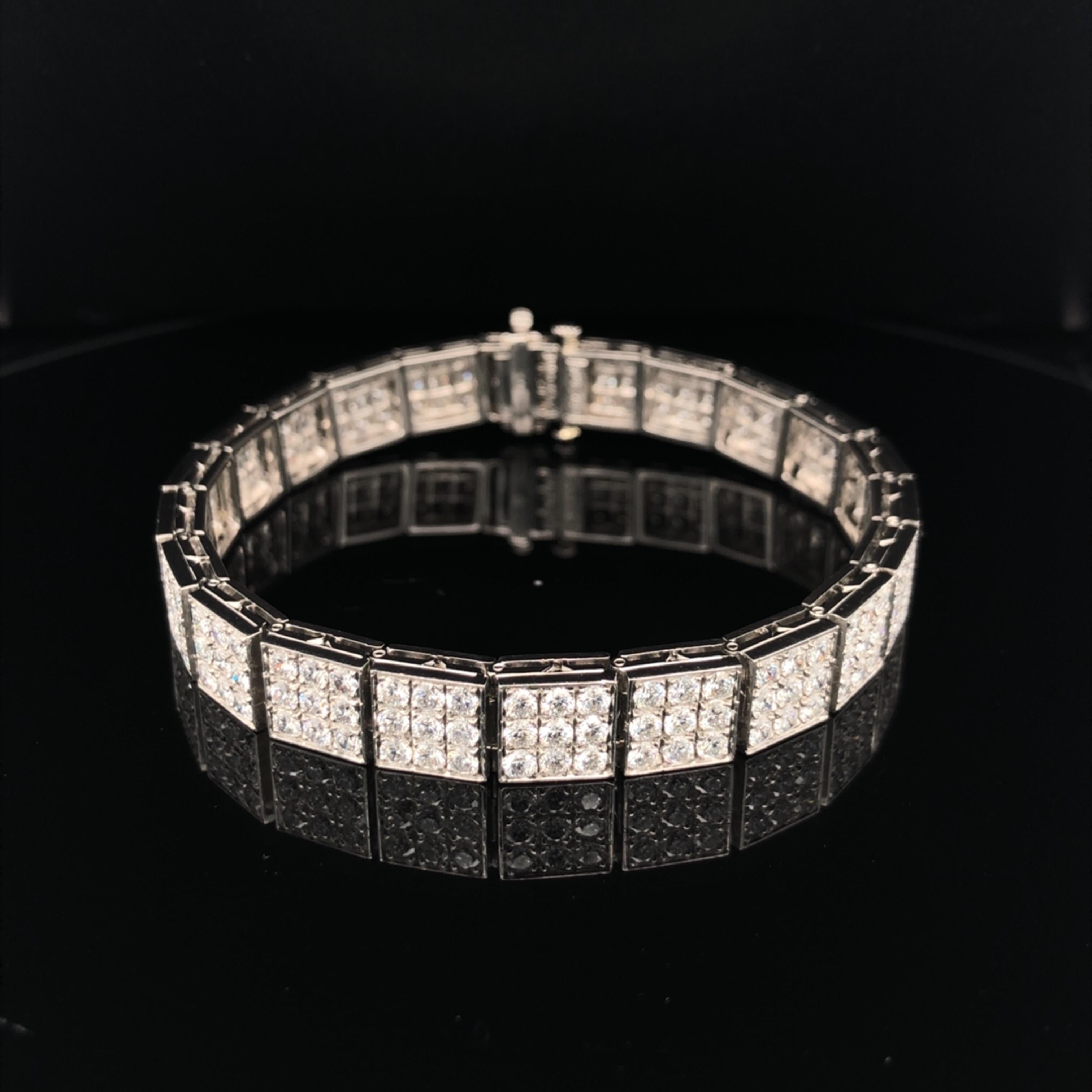 This Oscar Heyman platinum bracelet contains 198 round diamonds weighing 8.32 cts. (F-G/VS quality) set in ornaments featured a 3x3 square. It is stamped with the makers mark, IRID PLAT, and serial number 803845.

The bracelet measures 7'' in length