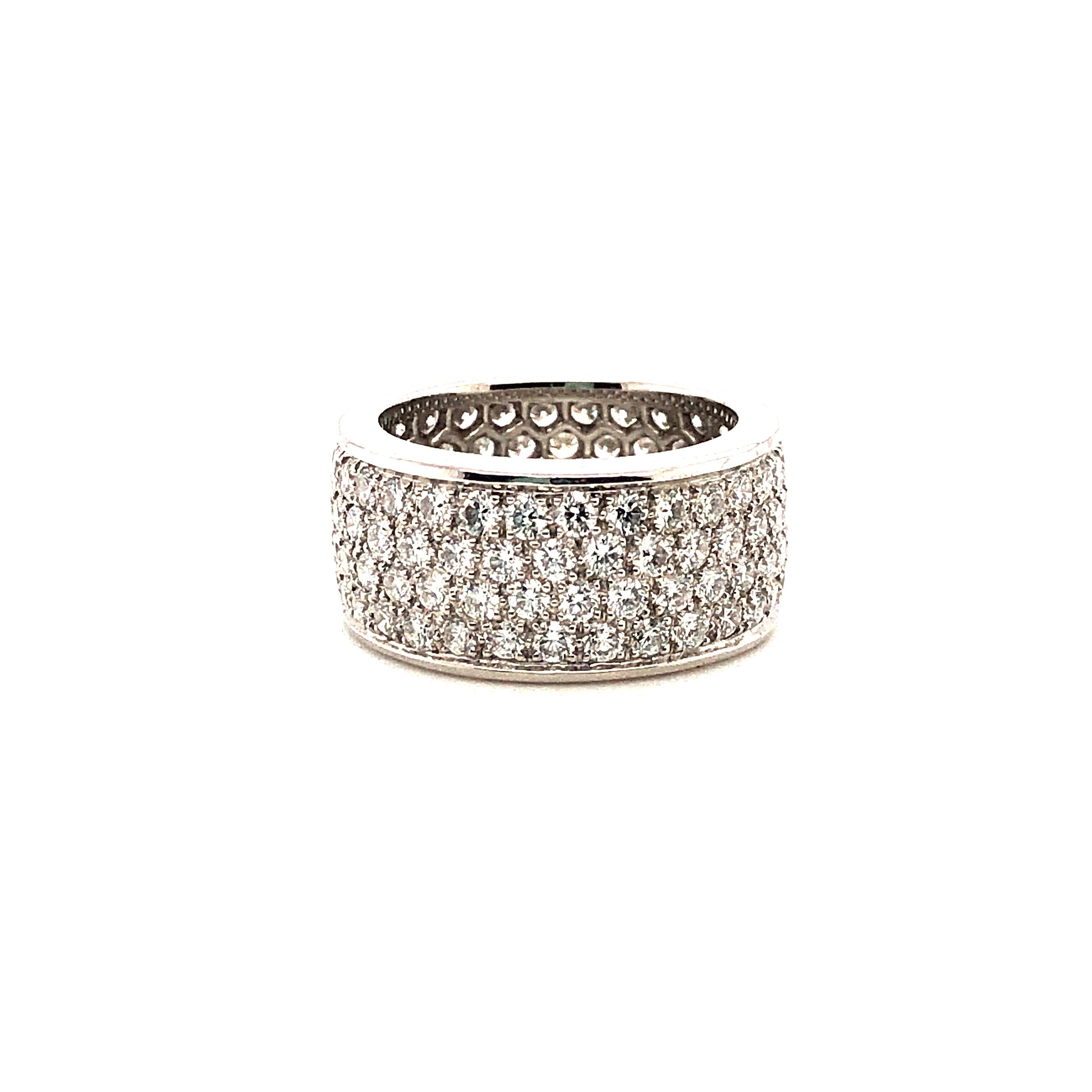 Oscar Heyman platinum band ring contains 120 round diamonds (3.97cts, F-G/VS) and is 10mm wide. It is stamped with the makers mark, IRID PLAT, and serial number W4907.

Size 6.5. Price will vary by size - inquire for specifics.

Custom hand