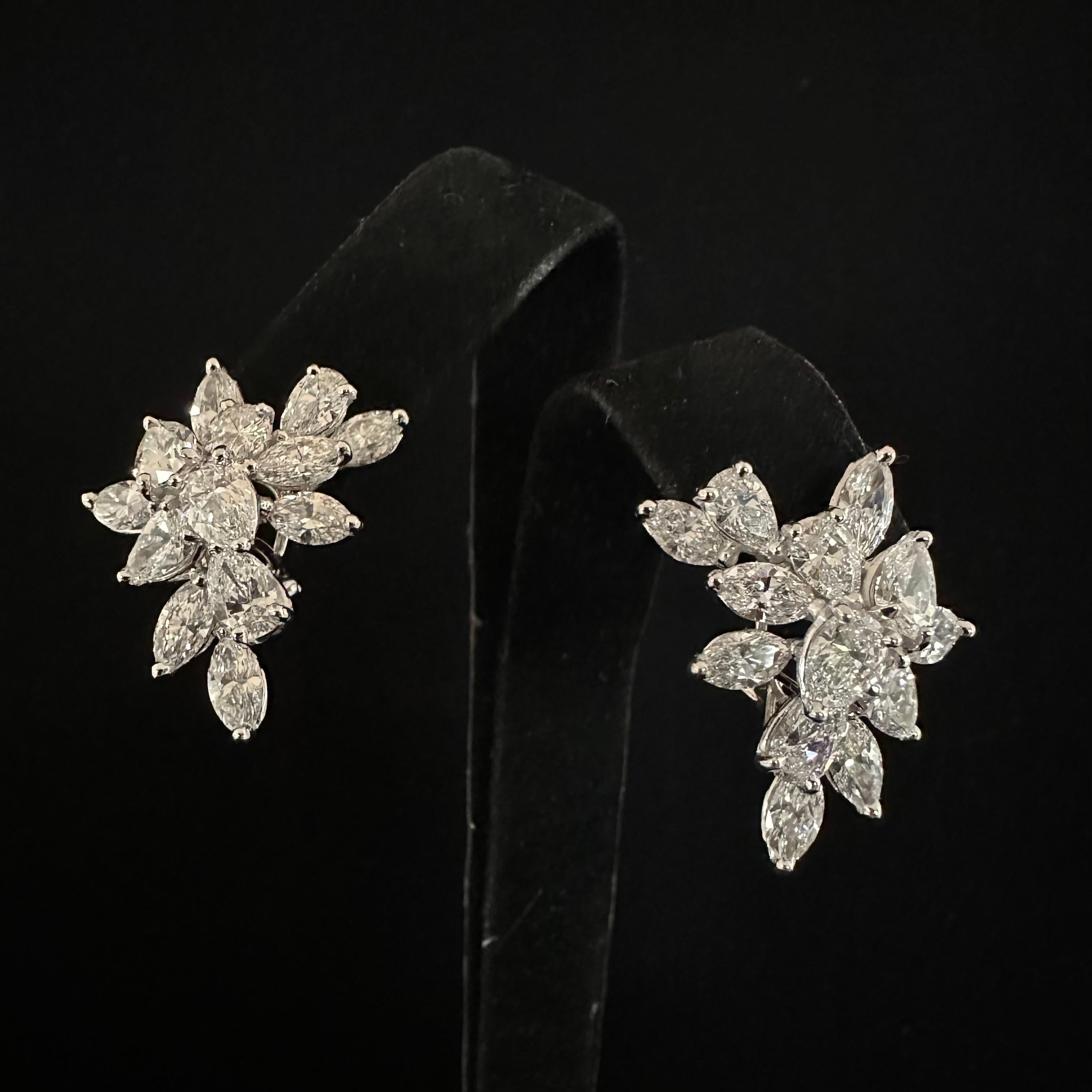 Oscar Heyman 
Platinum Hand Made Cluster Earrings
Containing 
12 Pear Shape Diamonds
14 Marquise Shaped Diamonds
Total Weight 10.35 cts.
Fine quality G - VVS 
Hallmarks: 702744
The Earrings have lever Backs and can be adjusted for a post if