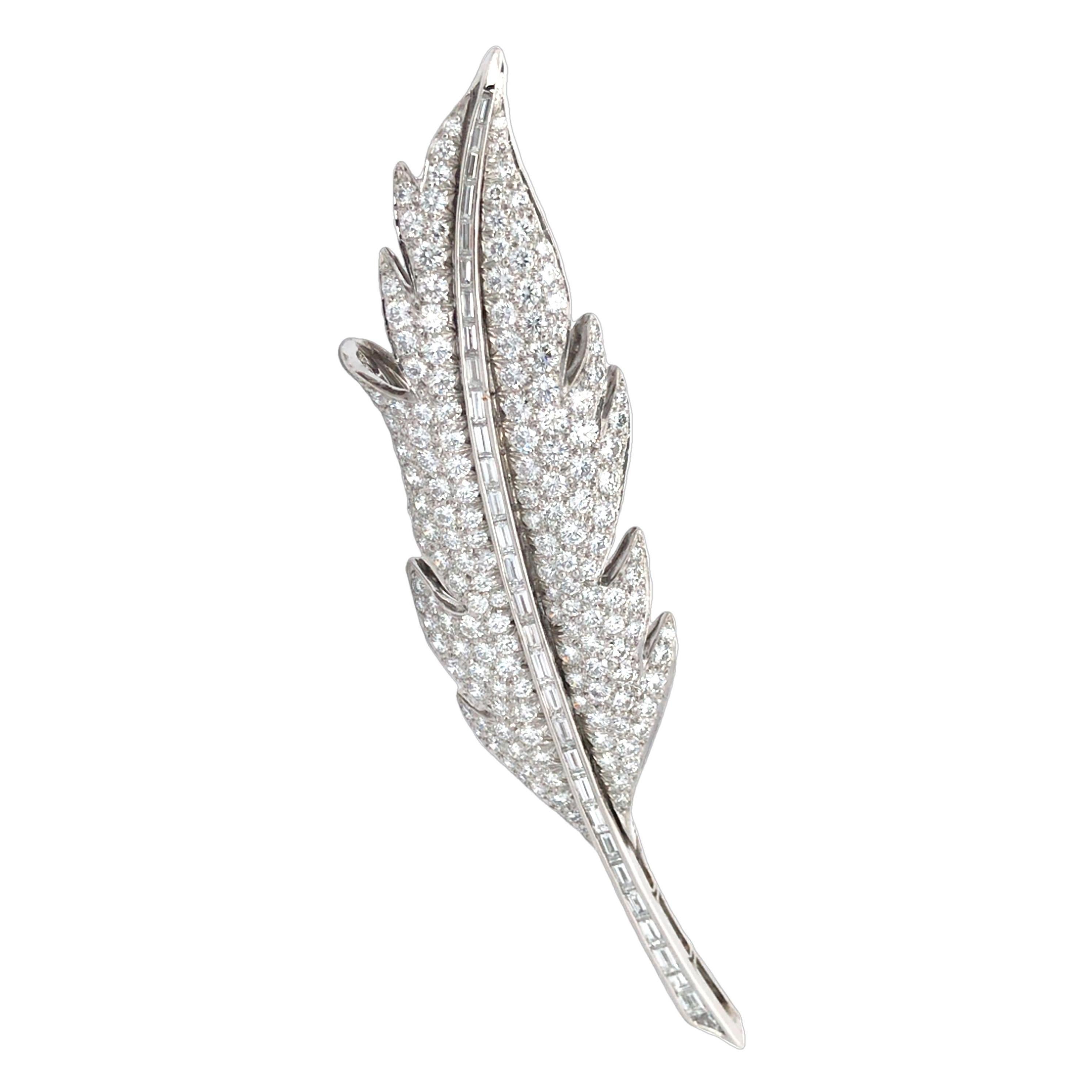 This exquisite feather brooch by Oscar Heyman captures the elegance of nature through masterful craftsmanship. Adorned with 168 round brilliant diamonds totaling approx. 7.60 carats, 30 baguette-cut diamonds (approx. 1.86 carats), and a single