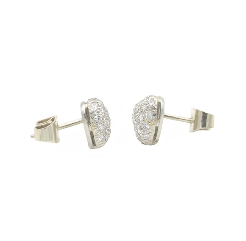 Oscar Heyman heart shaped diamond pave stud earrings.  Approximately 1 carat total weight in G-H VS round brilliant cut diamonds.  8.3mm high and  9.2mm wide.  Set in platinum with 14k white gold backs.  Circa 1990