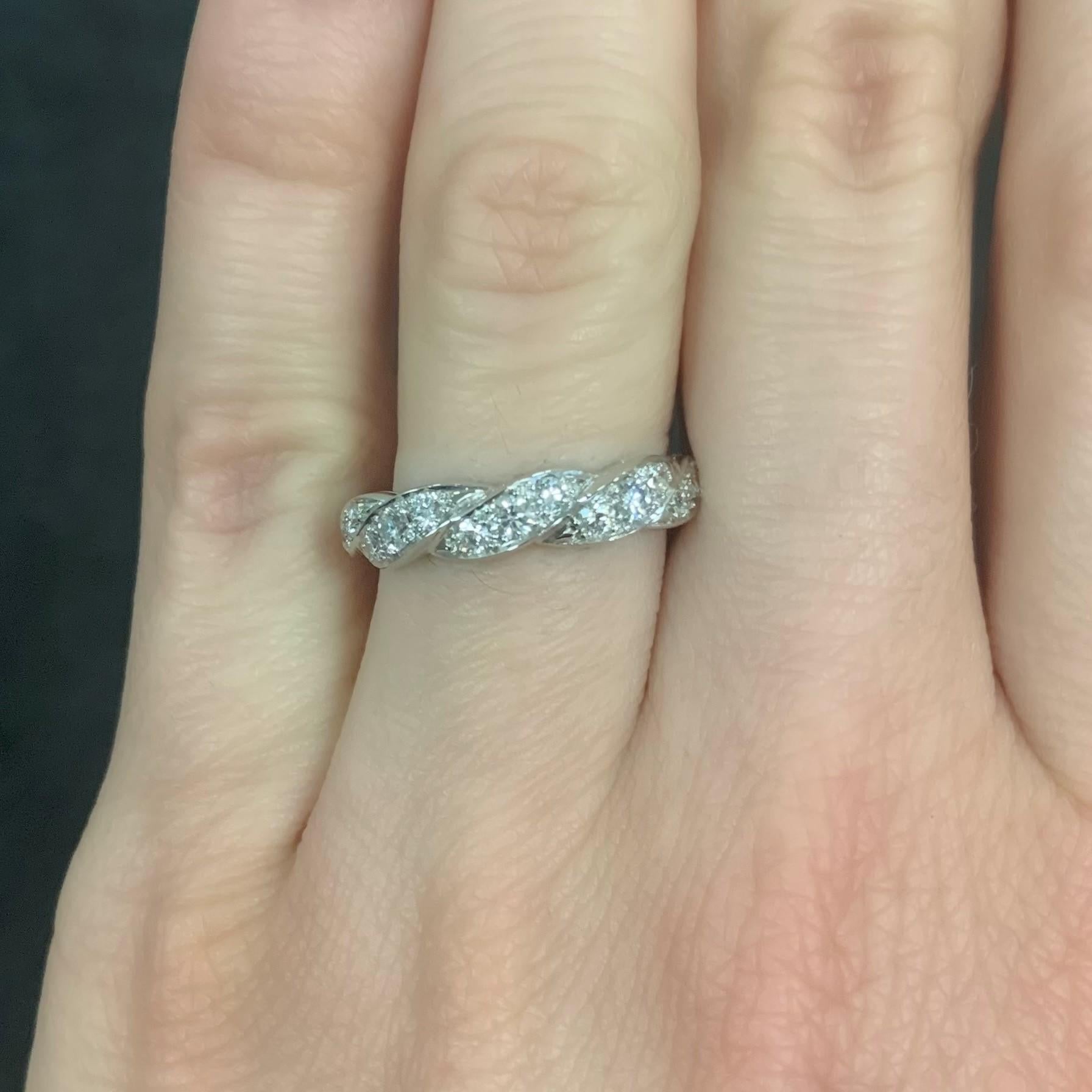 Oscar Heyman platinum twist partway wedding band ring contains 13 round diamonds (0.38tcw, F-G/VS quality). It is stamped with the makers mark, IRID PLAT, and serial number W5050.

Size 6.00. Can be sized from a 5-7 at no charge.

Additional sizes