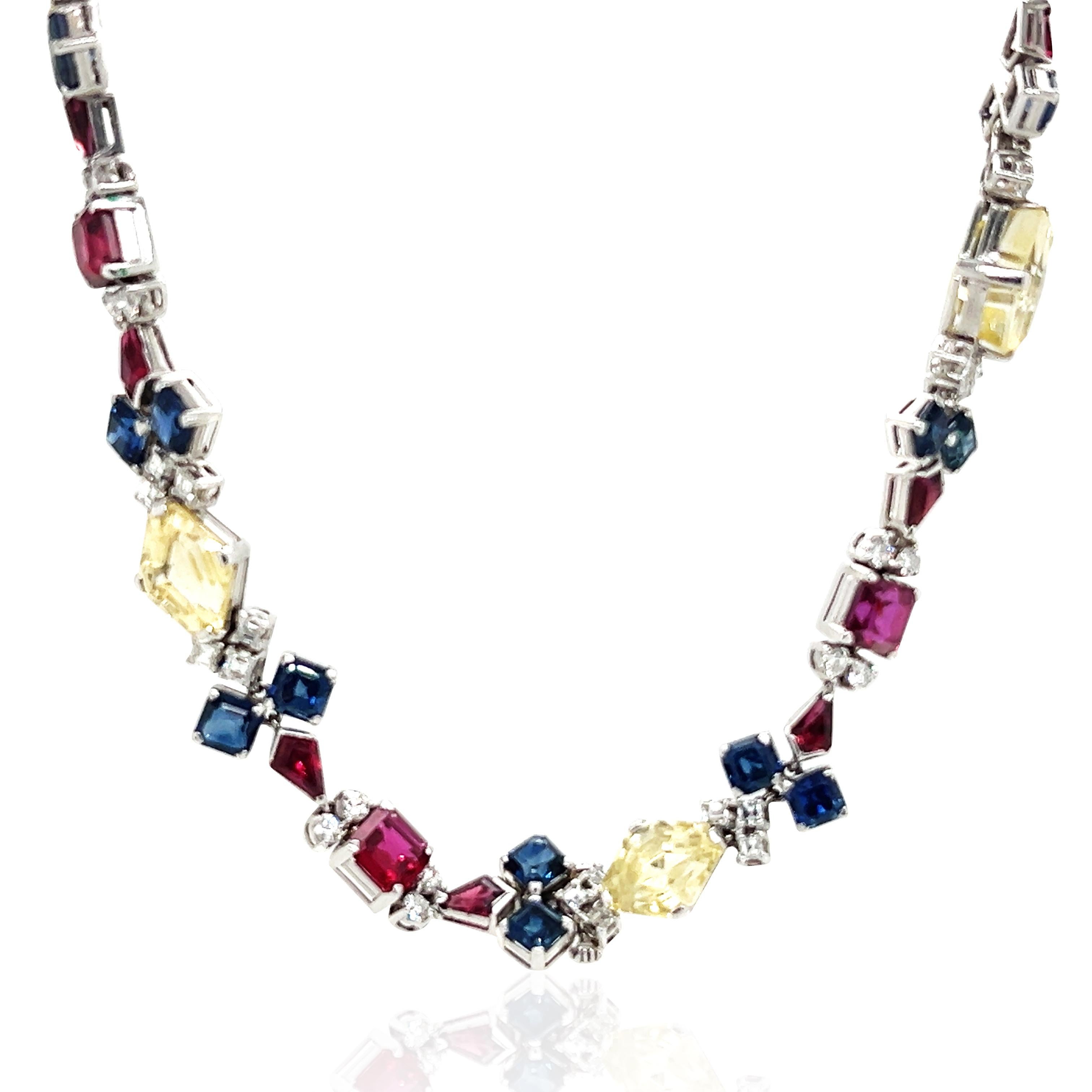 7 yellow sapphires total 30.67ct, 28 sapphire total 17.26ct, 7 rubies total 17.02ct, diamonds total 4.02ct. Accompanied with two GIA certificates, one stating that one ruby is of Thailand origin with no heat treatment, the other stating that one