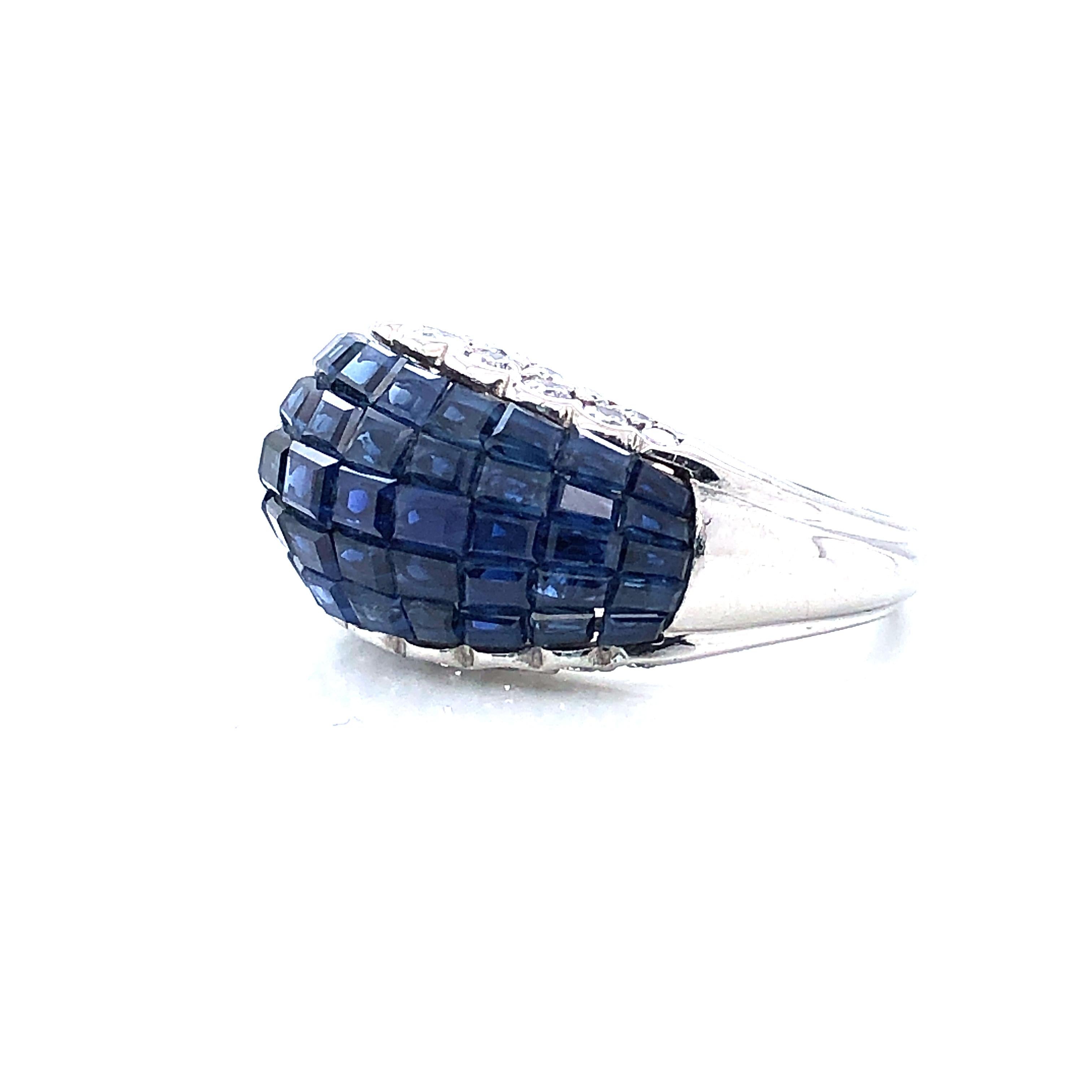 Oscar Heyman platinum ring contains 54 square sapphires in an invisible (or mystery) setting and 34 round diamonds (1.19cts). This piece is an impeccable specimen of invisibly set jewelry. The technique involves grooving the underside of square