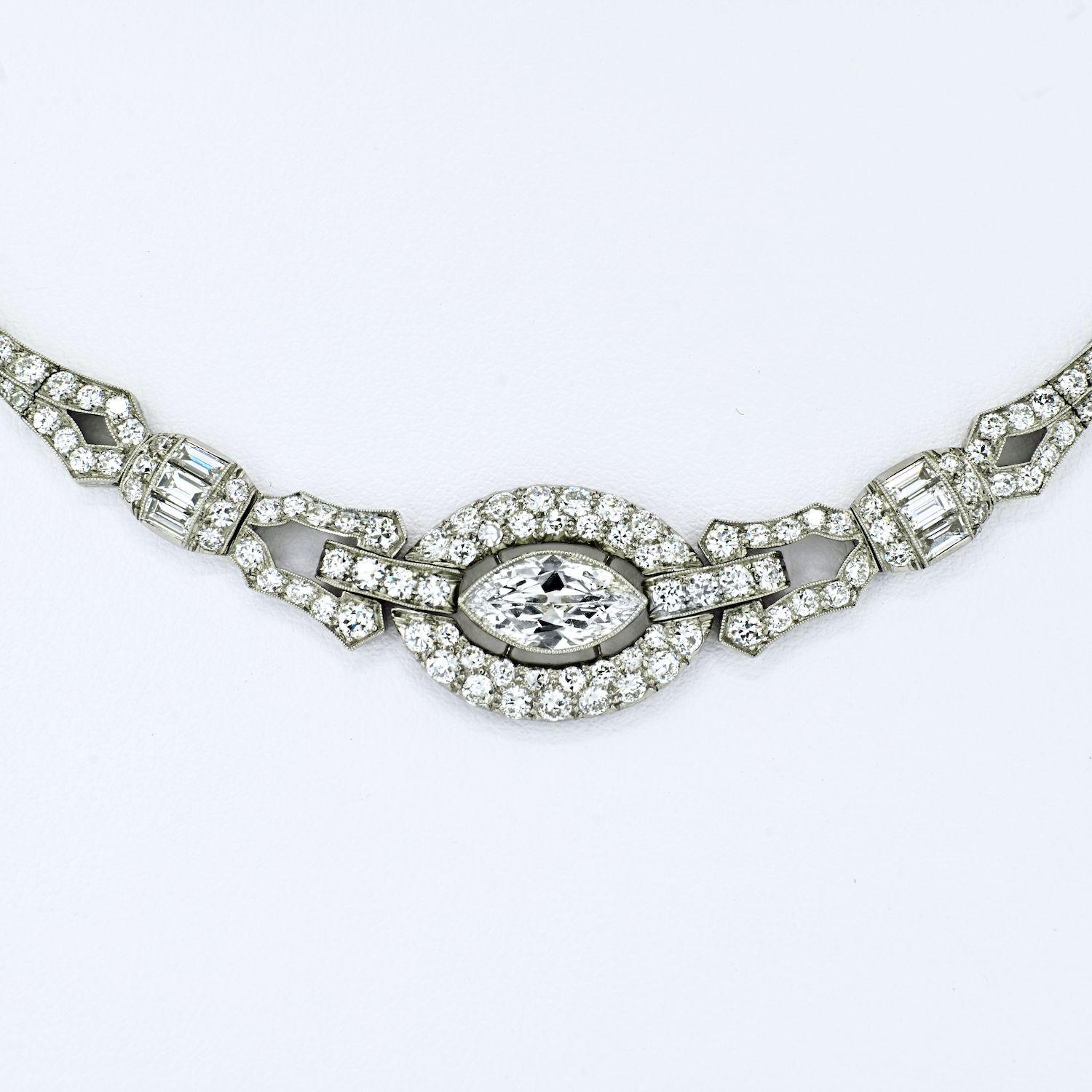 Delicate diamond necklace by Oscar Heyman. Crafted in the Art Deco era, and fits like a choker. Perfect as a wedding necklace that is subtle yet timeless. 
A floating marquise-cut diamond within a transitional-cut diamond frame, joins openwork