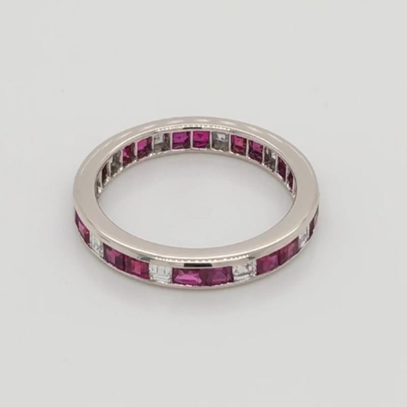 Oscar Heyman platinum ruby and diamond wedding band ring contains 10 Square Diamonds (F-G/ VS+ quality) weighing 0.41cts and 20 Square Rubies weighing 1.38cts that are channel set. It is 3mm wide and stamped with the makers mark, IRID PLAT, and