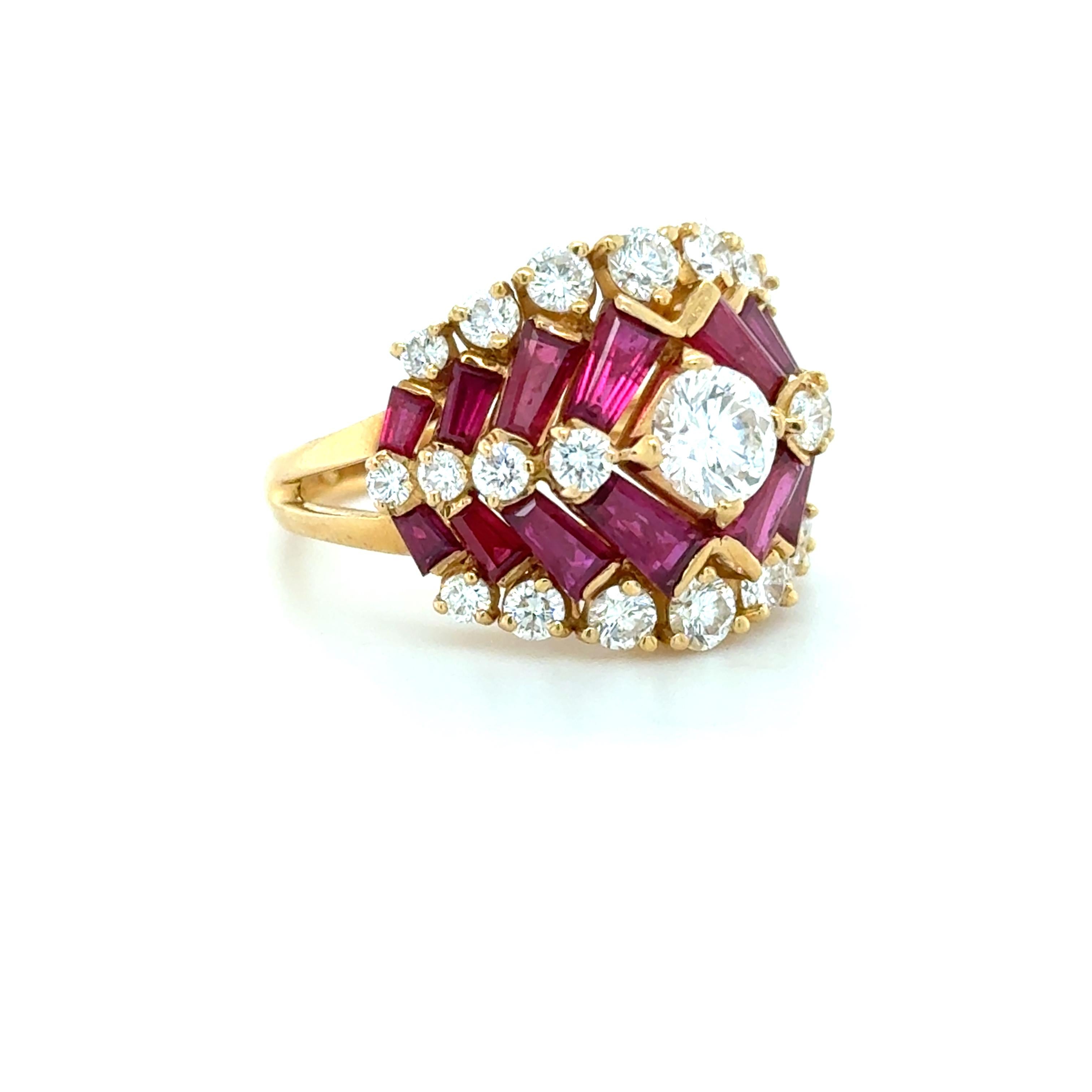 This beautifully classic ring designed by Oscar Heyman boasts a bright round brilliant cut diamond weighing approximately 0.60 carat, flanked by rows of round brilliant cut diamonds weighing approximately 1.00 carat total and tapered baguette rubies