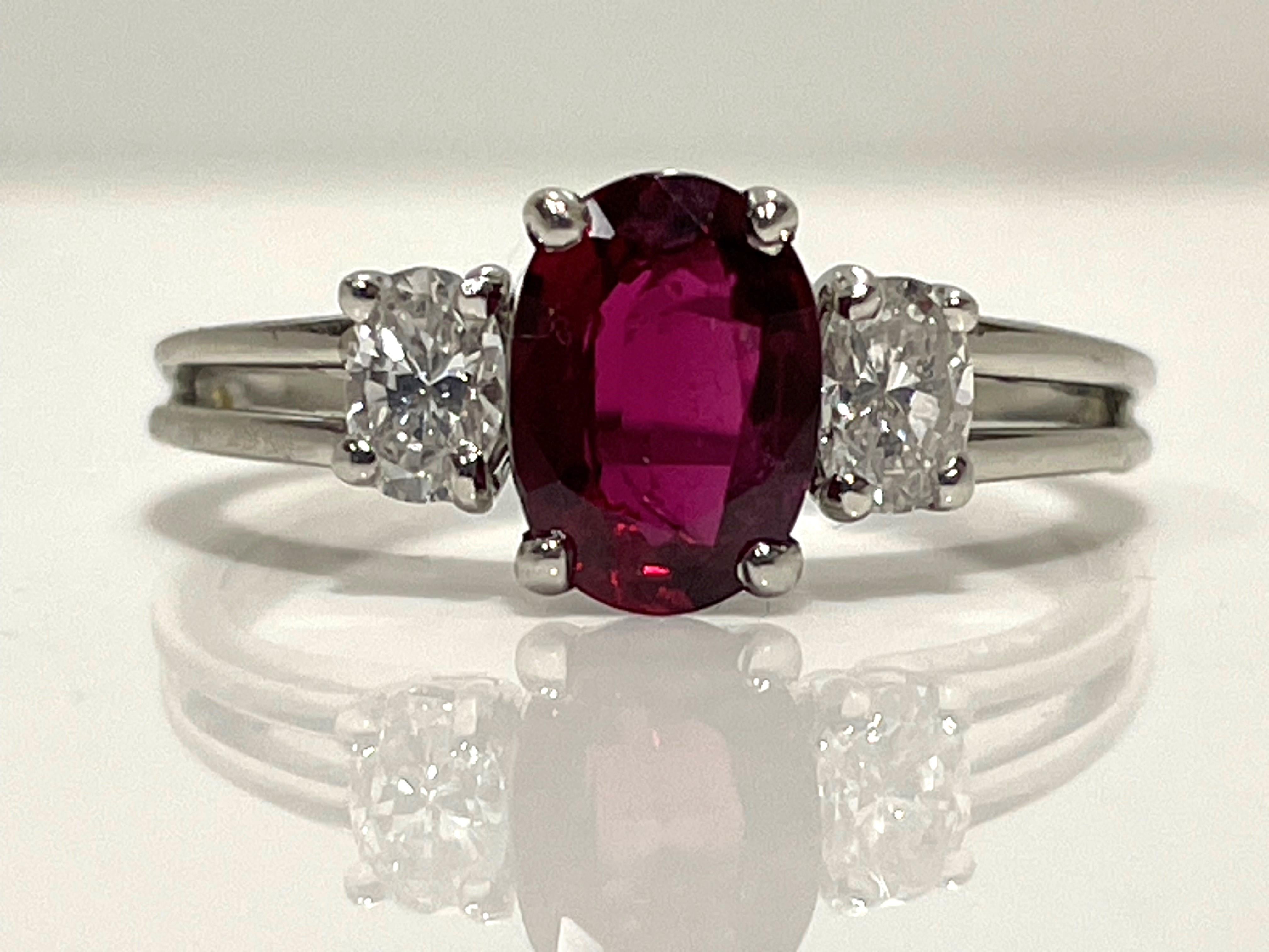 Beautiful 3-stone ring by designer Oscar Heyman.
Platinum split shank.
1.19ct oval ruby.
2 oval side diamonds, approximately .20ct each, F color, VS clarity.
Finger size 8.5 (can be made any size).