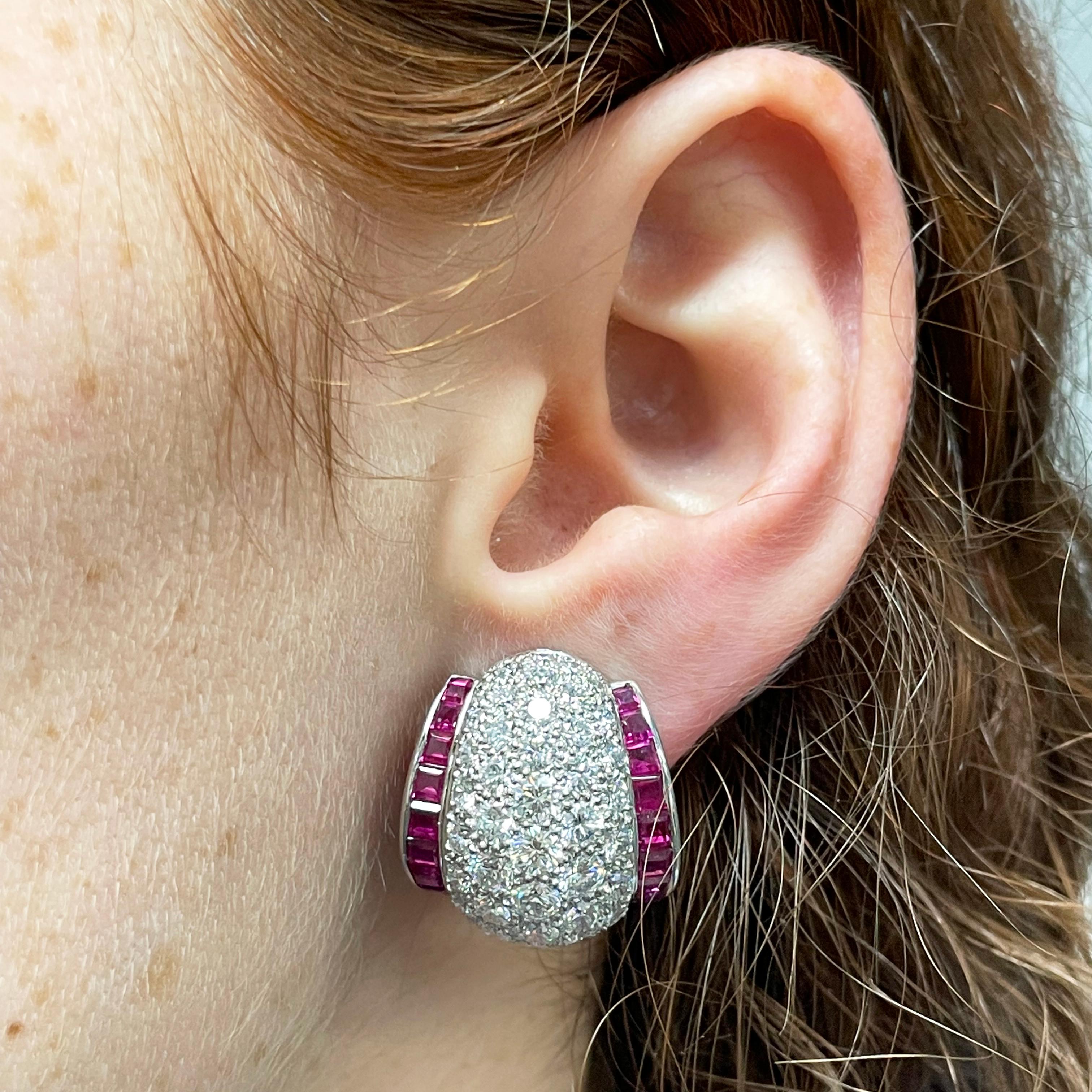 Oscar Heyman platinum 'shrimp' earrings contain 96 round diamonds weighing 7.93tcw (F-G/VS quality) and 52 square calibre rubies weighing 4.81tcw. The face of the earrings measures 22mm tall by 20mm wide. They are stamped with the makers mark, PLAT,