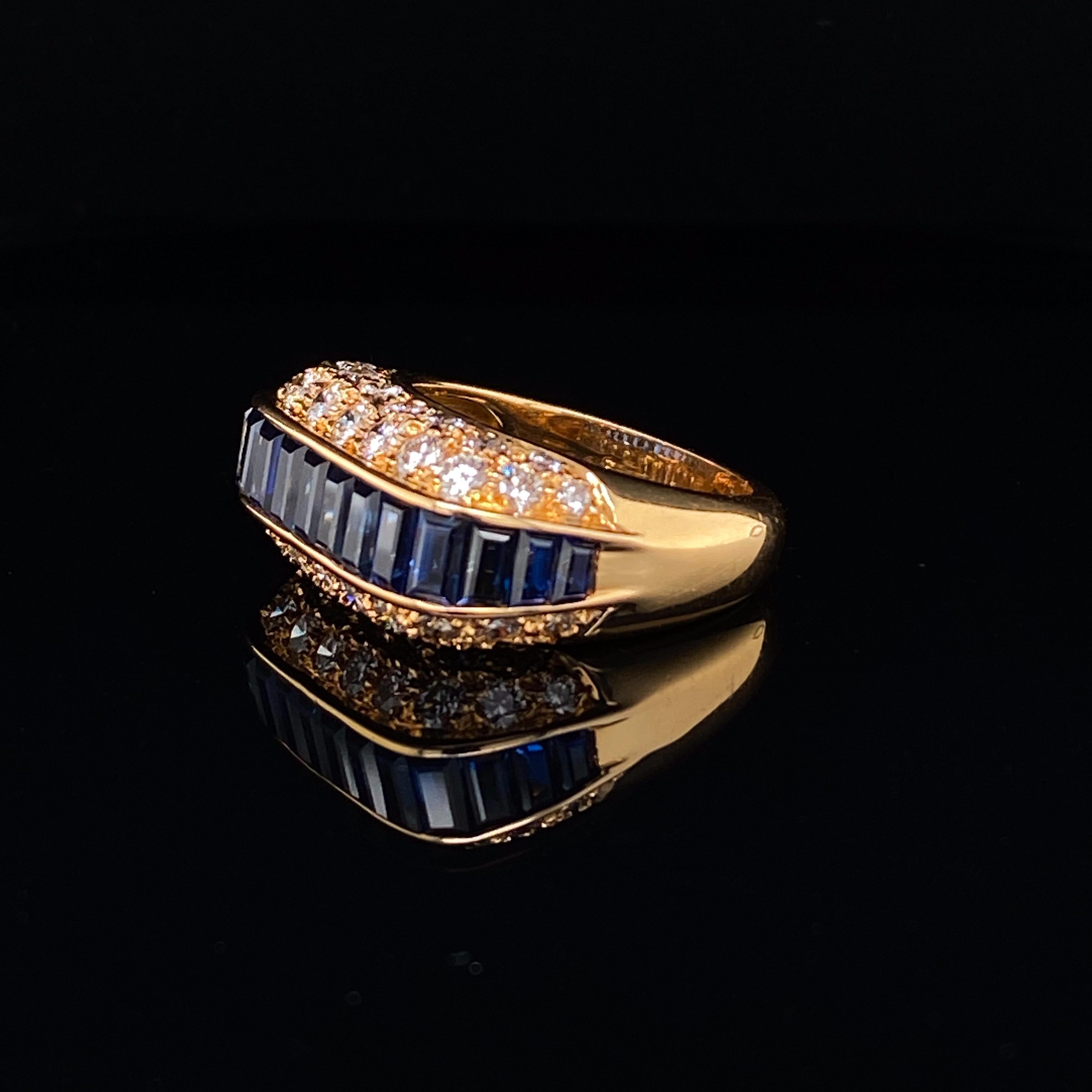 Oscar Heyman sapphire and diamond 18 karat yellow gold cocktail ring.

An elegant sapphire baguette and diamond ring by Oscar Heyman Bros. circa 1960

Set with rectangular baguette cut sapphires, in open back rubover channel settings framed either