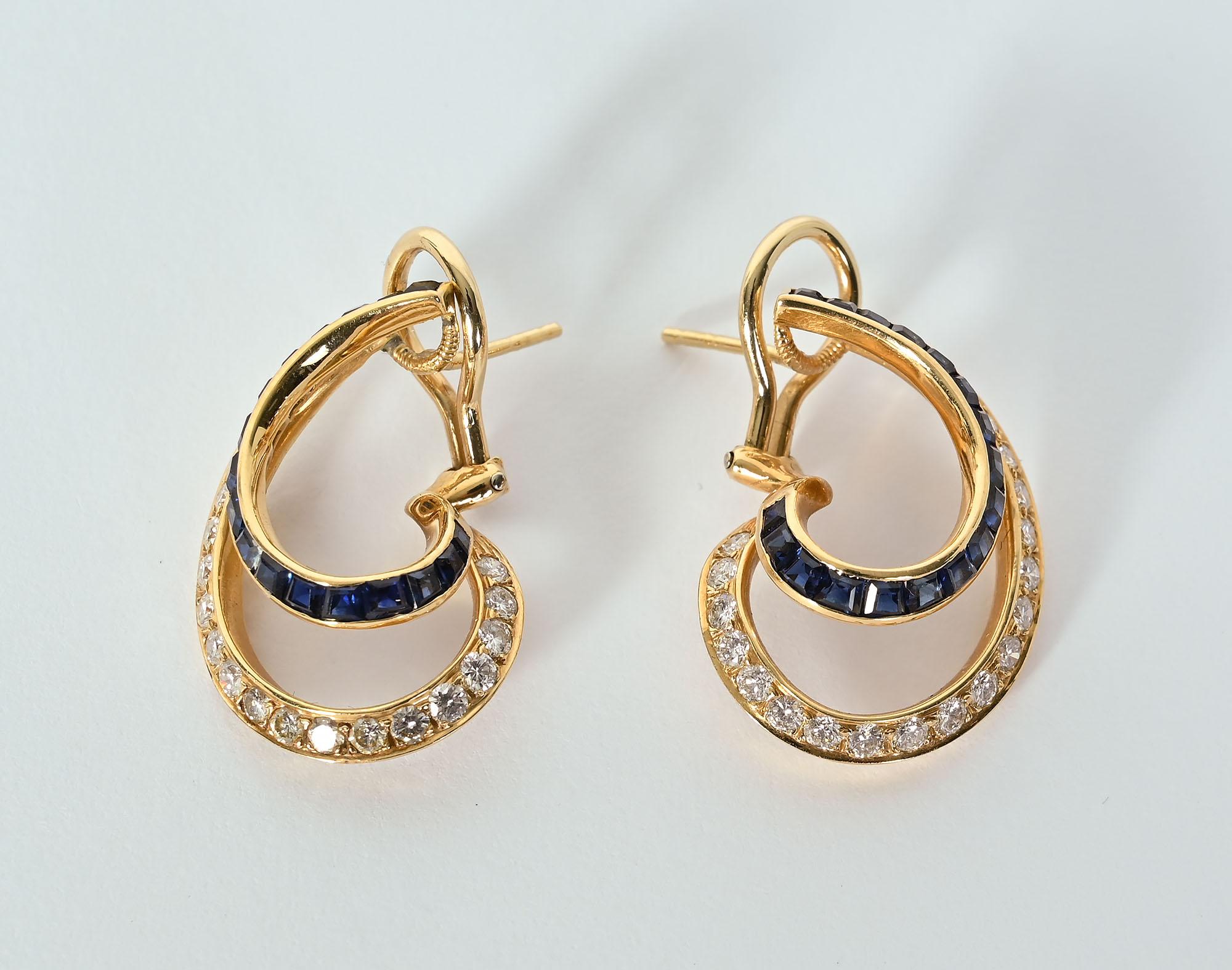 Delicate and graceful diamond and sapphire earrings by Oscar Heyman. The earrings have approximately 1.5 carats of round brilliant diamonds; SI quality; G color. The sapphires weigh approximately 1 carat. The earrings are open and airy with a lovely