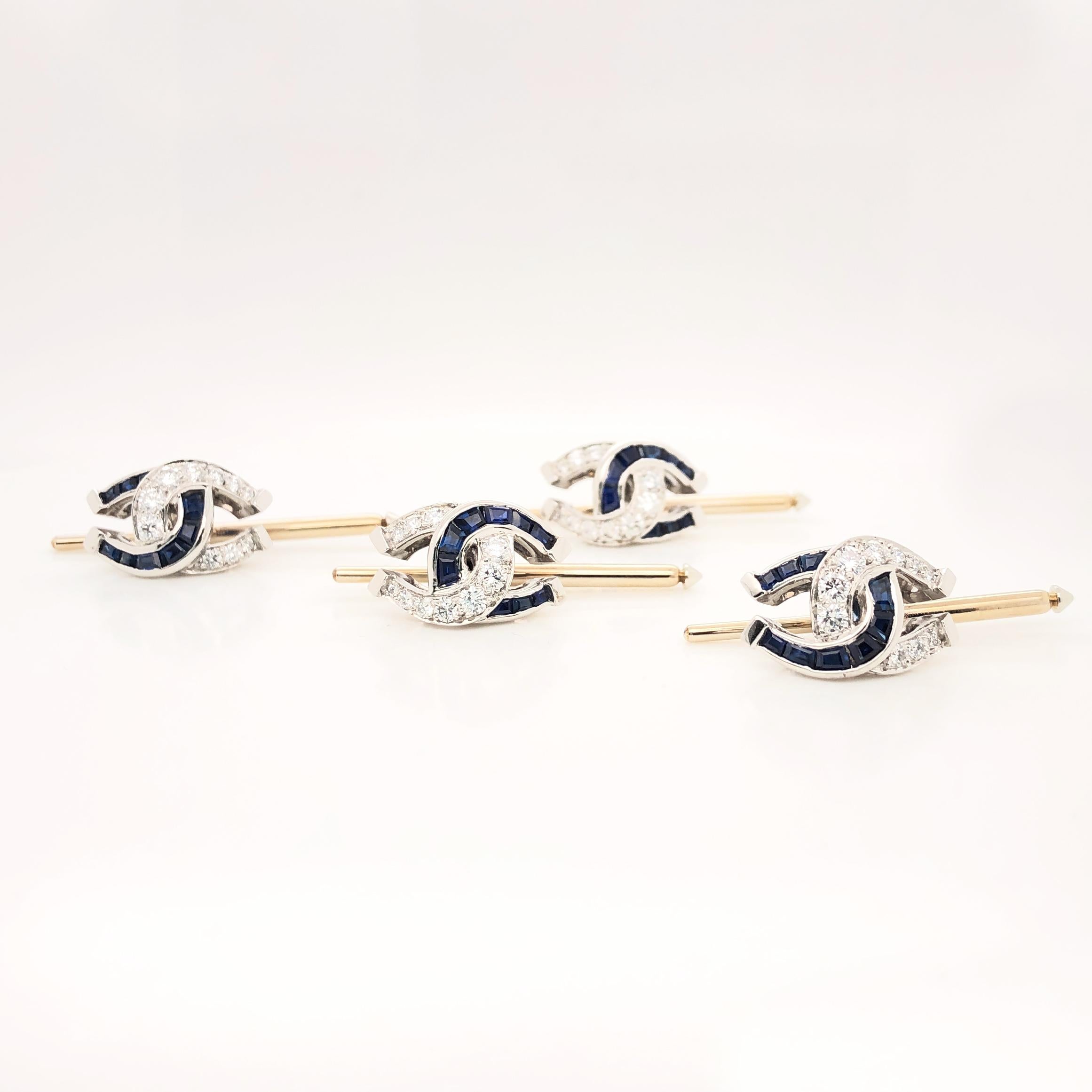 These fabulous Oscar Heyman horseshoe motif shirt studs (set of 4) are made in platinum and set with 36 square sapphires (1.68cts) and 40 round diamonds (1.20cts). It is stamped with the makers mark, IRID PLAT, and serial number 901603. The