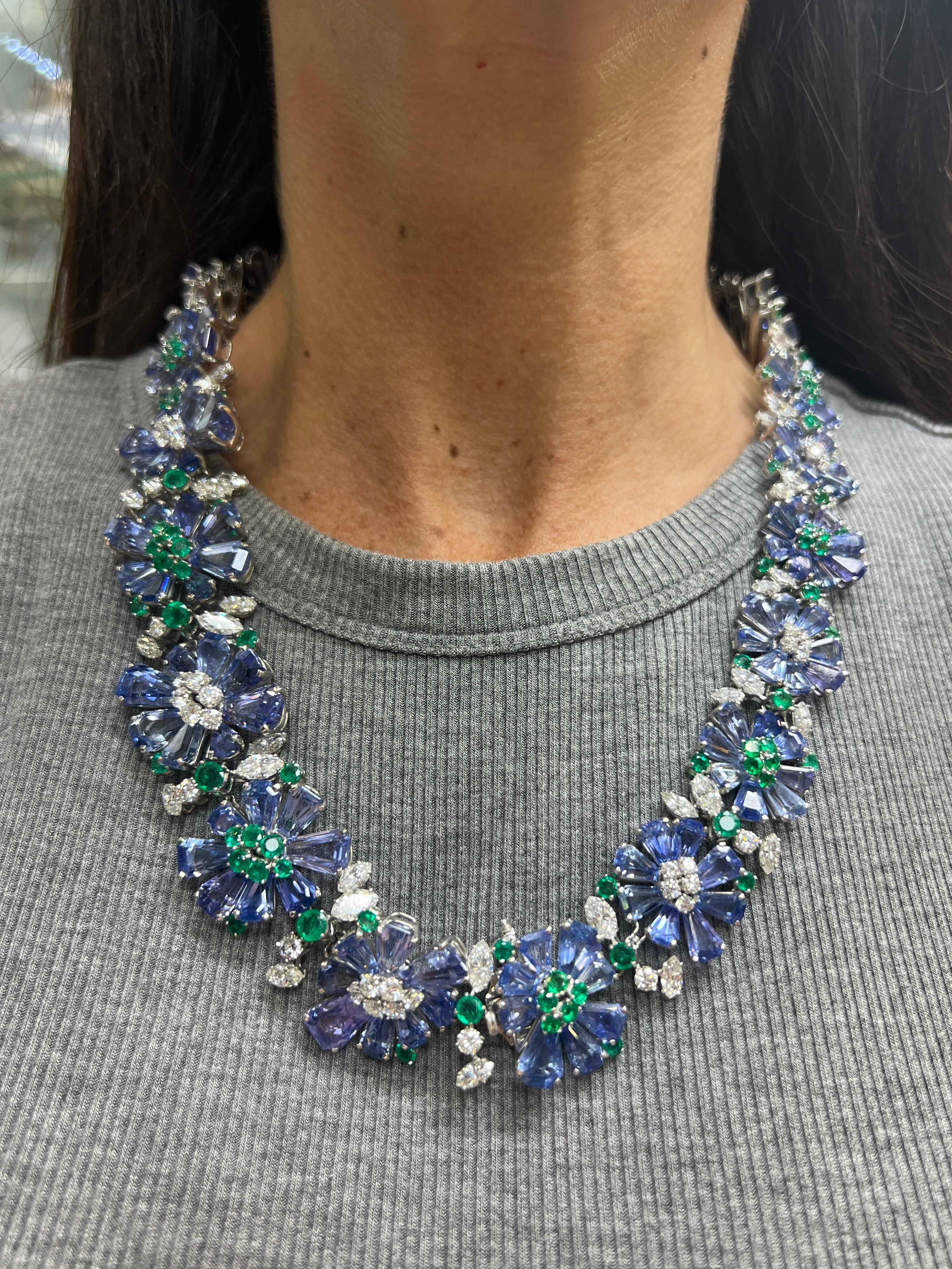 Oscar Heyman Sapphire Emerald and Diamond Necklace and Bracelet Set

Oscar Heyman & Brothers sapphire set composed of sapphire flower motifs. The petals are set with fancy shaped sapphires, and the centers are clustered with round cut emeralds and