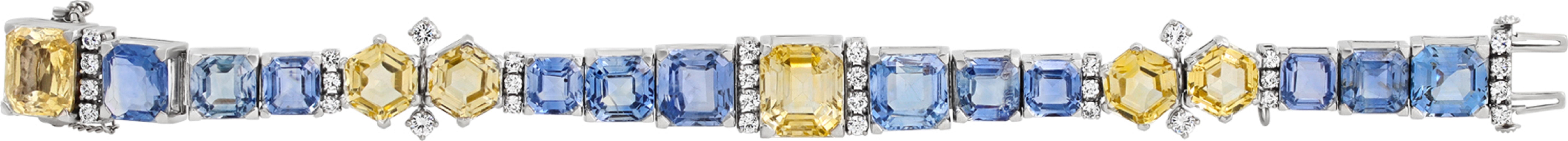 Original vintage Oscar Heyman bracelet with emerald cut and hexagonal fancy cut blue and yellow Ceylon sapphires (estimate over 45.00 carats), and round brilliant cut diamonds set in Platinum. Circa 1947. Comes with Oscar Heyman Certificate of