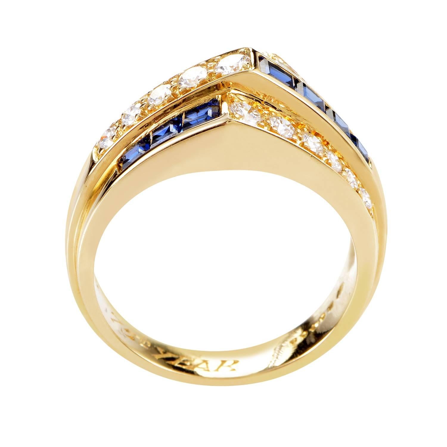 The tasteful contrast between captivating sapphires totaling 0.75ct and brightly glowing diamonds weighing in total approximately 0.65ct graces this 18K yellow gold ring from Oscar Heyman with eye-catching allure and pleasant appeal. <br/> Ring Top