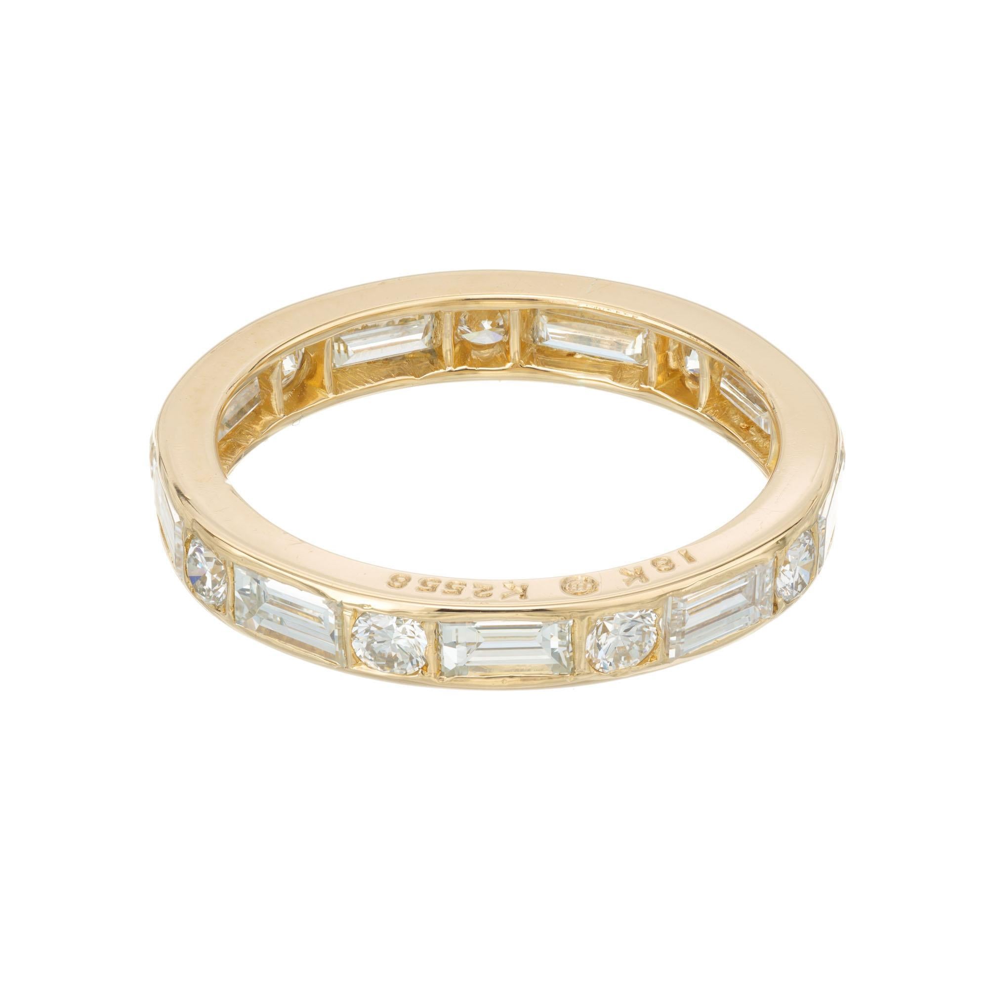 Oscar Hyman Brothers 18k yellow gold Eternity band ring. 9 round and baguette diamonds set in a 18k yellow gold setting.     

9 round diamonds, approx. total weight .30cts
9 baguette diamonds, approx. total weight .95cts
Size 4 3/4 and not