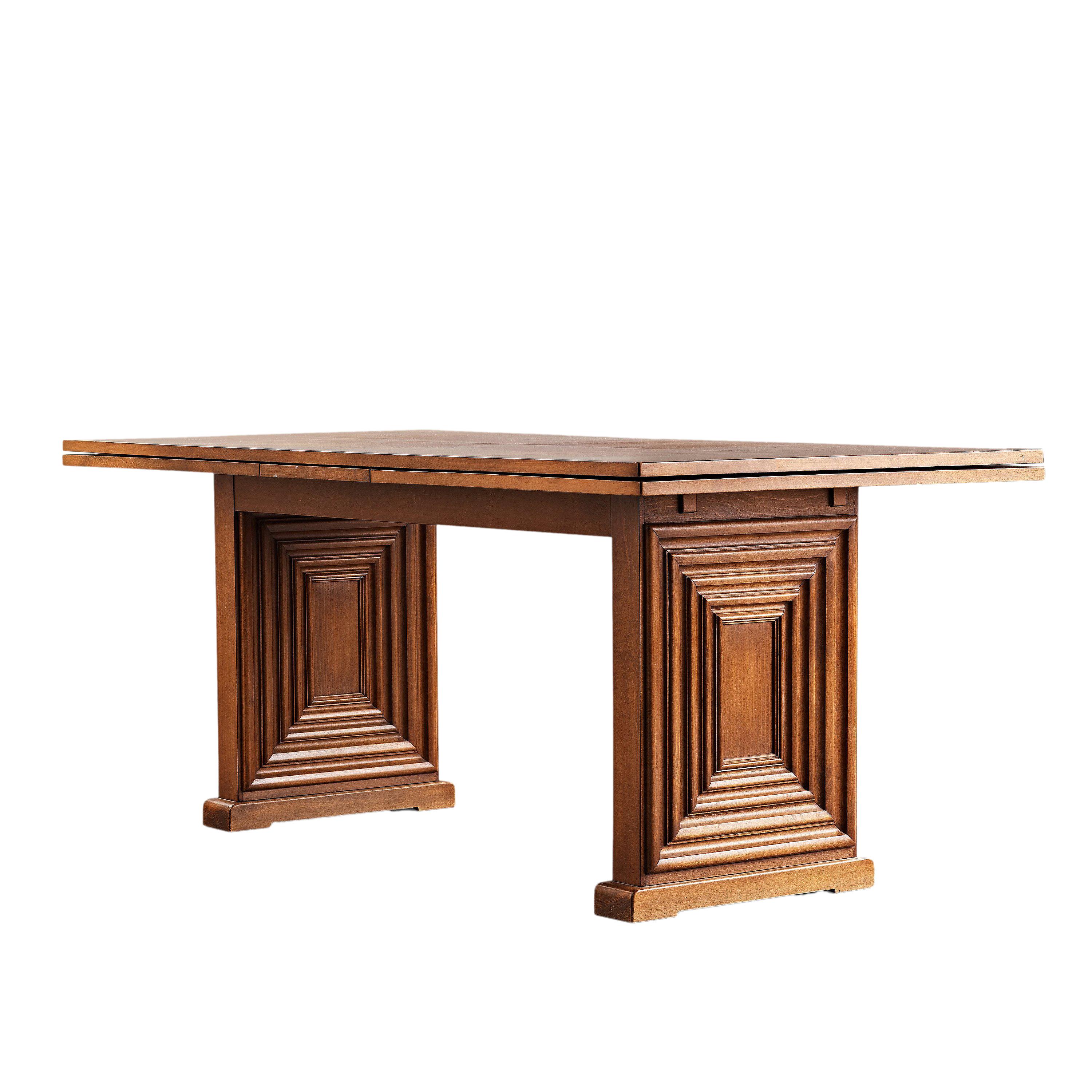 Oscar Nilsson (attributed to) large dining table, executed at Isidor Hörlin AB, Stockholm, 1940s. The base with geometrical relief pattern in stained beech and the top in walnut. Comes with two extension leaves.

Length without leaves is 180 cm (70