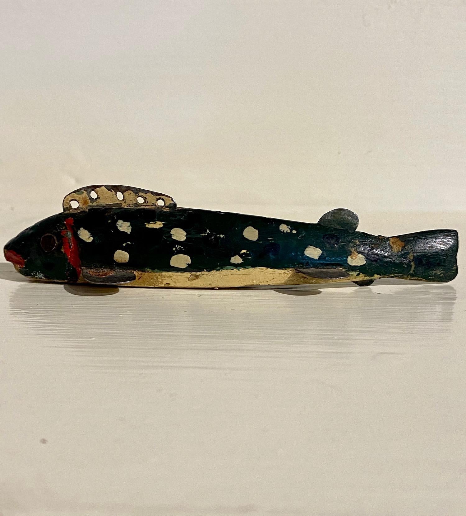 Oscar Peterson Minnow Decoy repainted by Jess Ramey, Cadillac, Michigan, circa 1930, an early Period II Peterson working ice fishing decoy that received an in-use working repaint by Jess Ramey in a minnow pattern with cream dots on a dark green